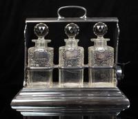 A Victorian Silver-Plate Tantalus Height 12 1/2 inches.