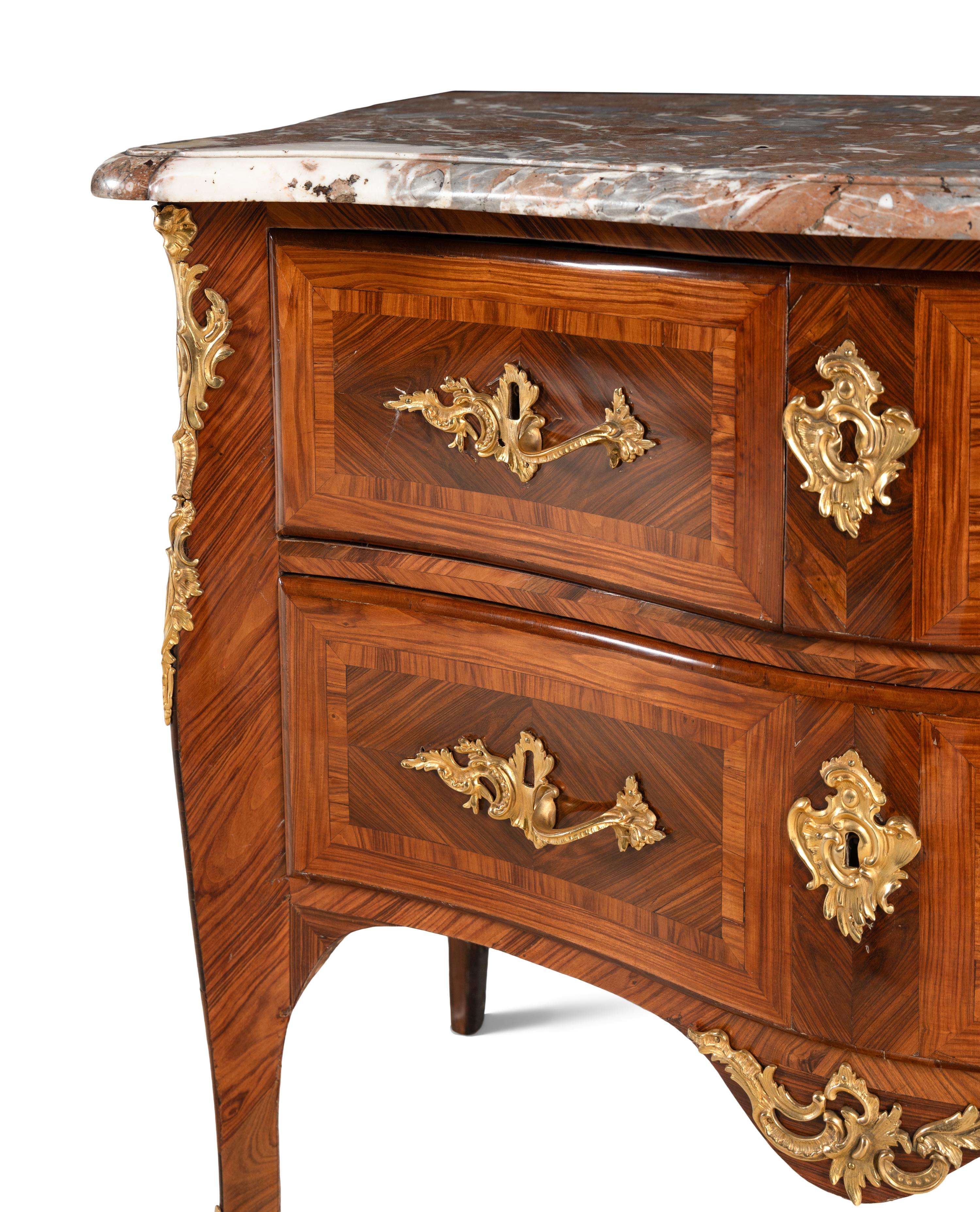 A Louis XV Gilt Bronze Mounted Kingwood and Tulipwood Marble-Top Commode