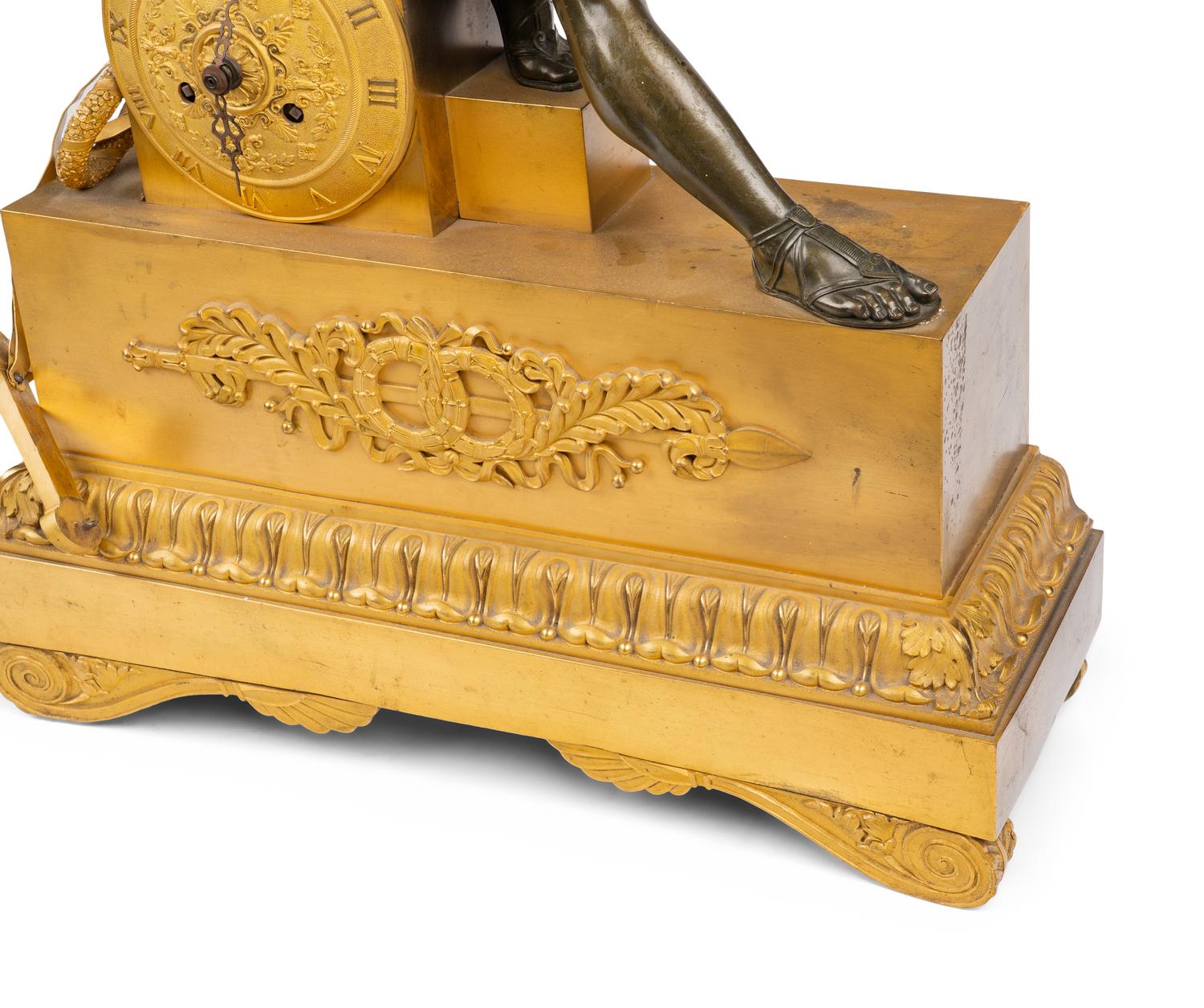 An Empire Gilt and Patinated Bronze Figural Mantel Clock