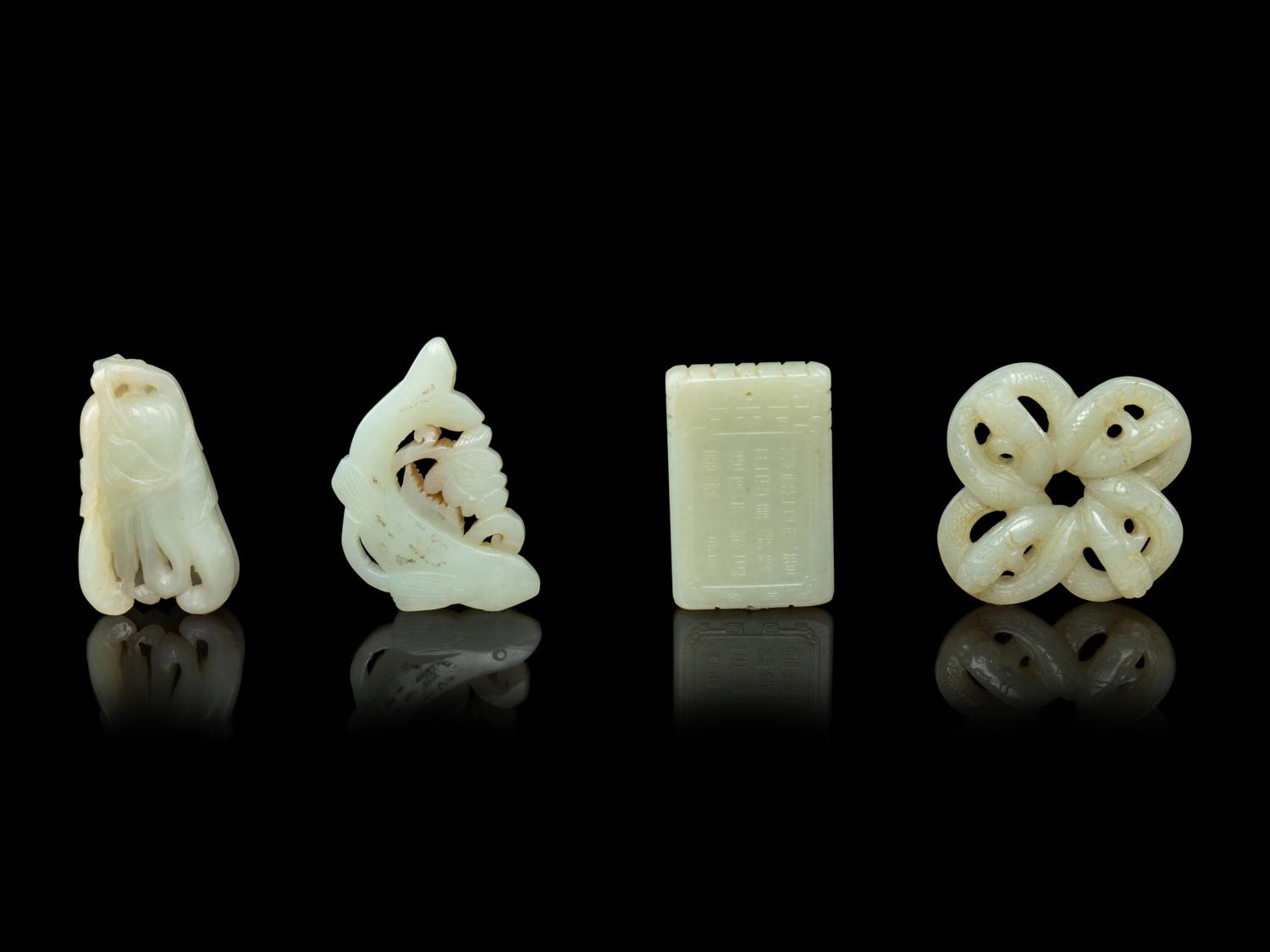 Four Chinese Pale Celadon Jade Pendants