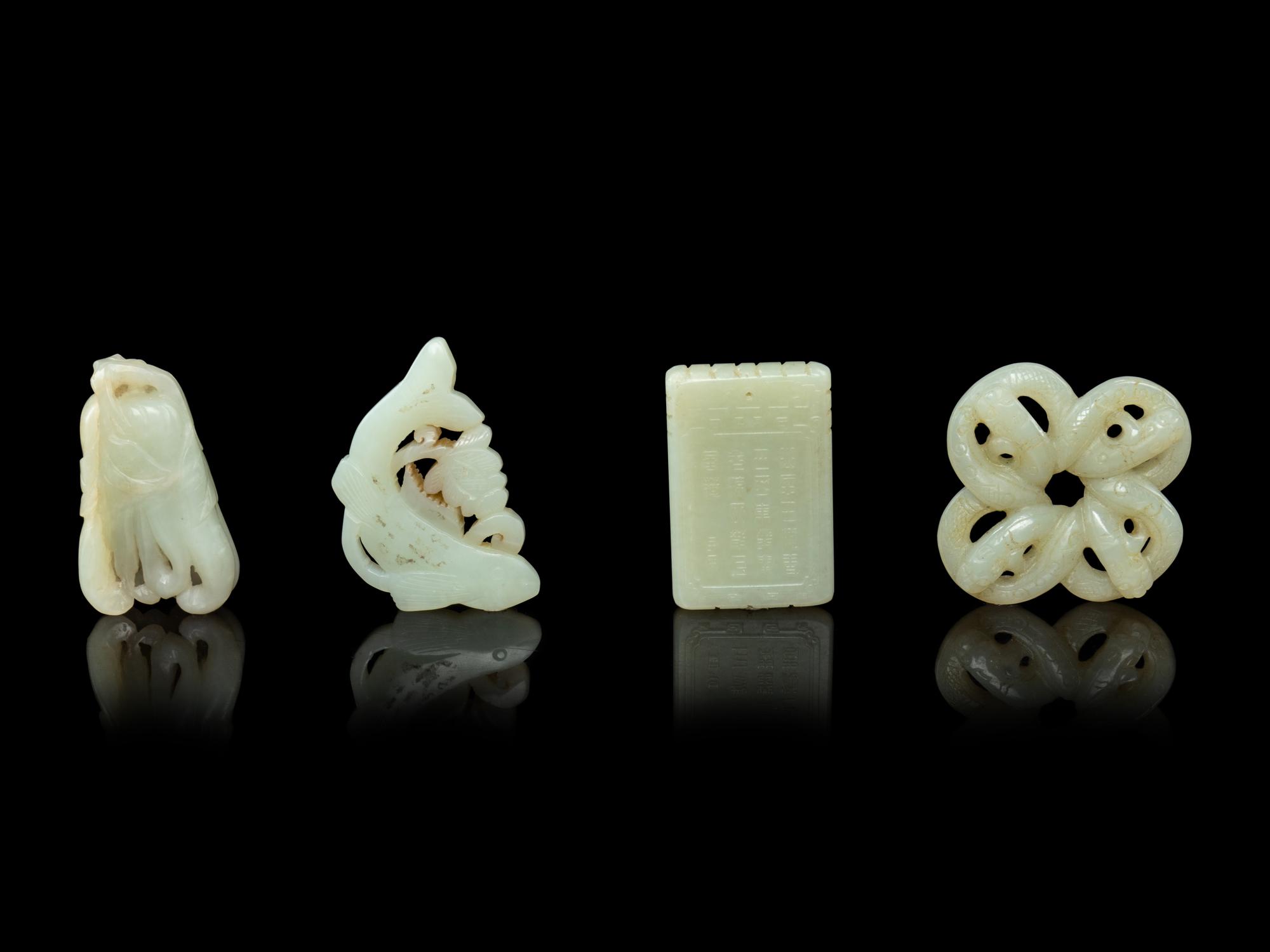 Four Chinese Pale Celadon Jade Pendants
