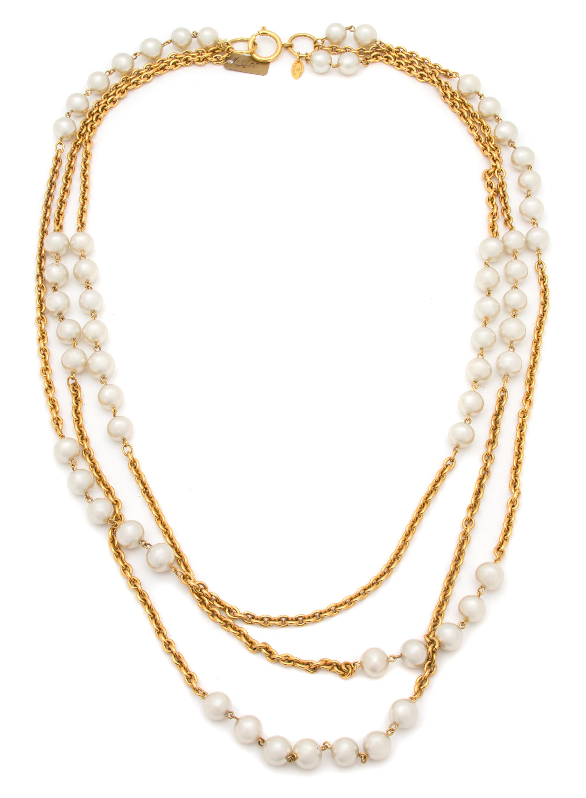 A Chanel Goldtone and Faux Pearl Triple Strand Necklace, Shortest strand: 34".