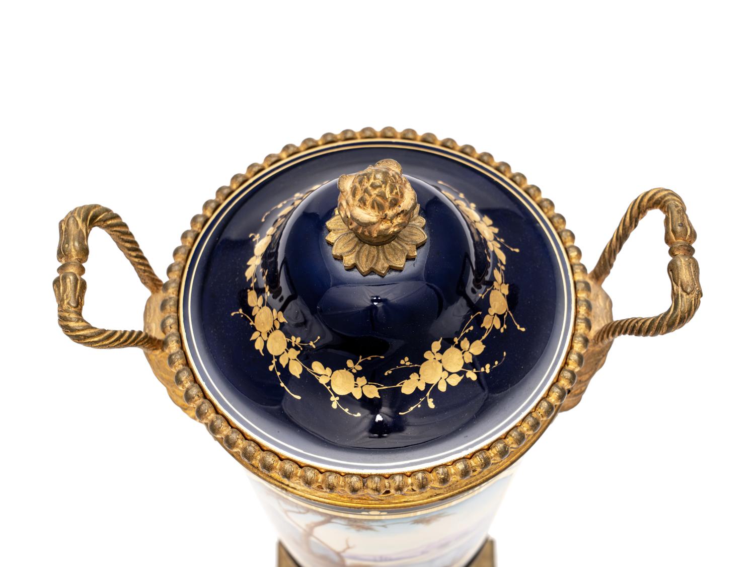A Pair of Sèvres Style Gilt Bronze-Mounted Porcelain Urns
