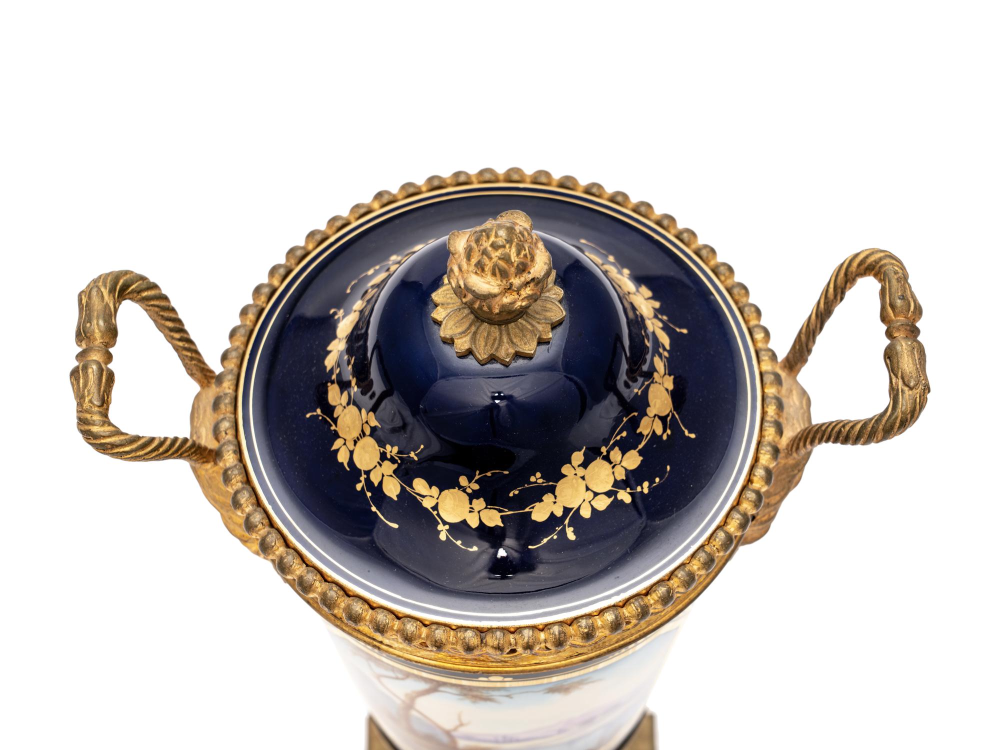 A Pair of Sèvres Style Gilt Bronze-Mounted Porcelain Urns