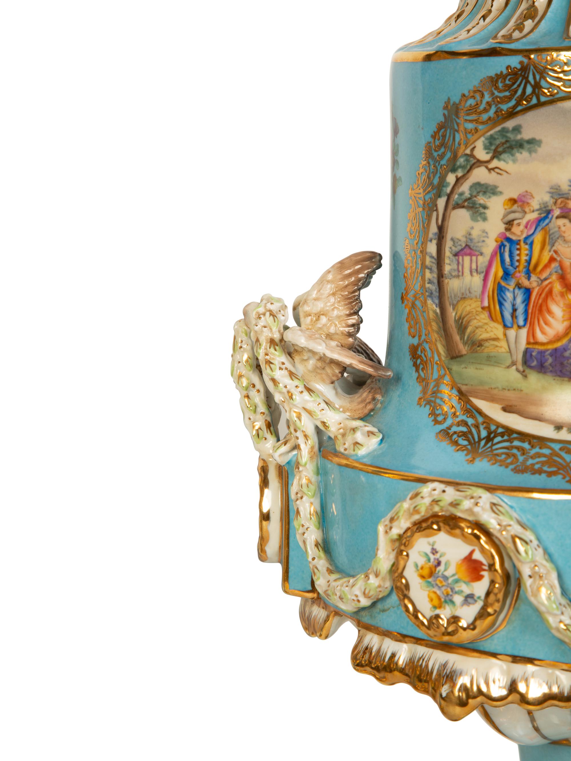 A Pair of Sèvres Style Porcelain Urns