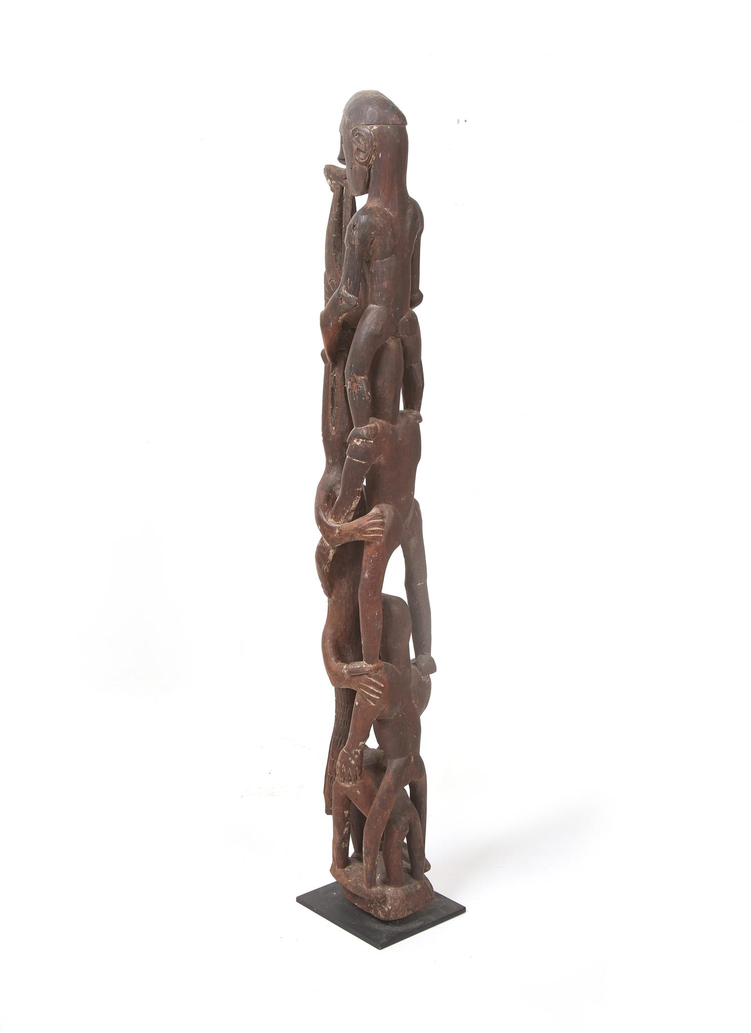 An Asmat Figure COMBINED WITH 31