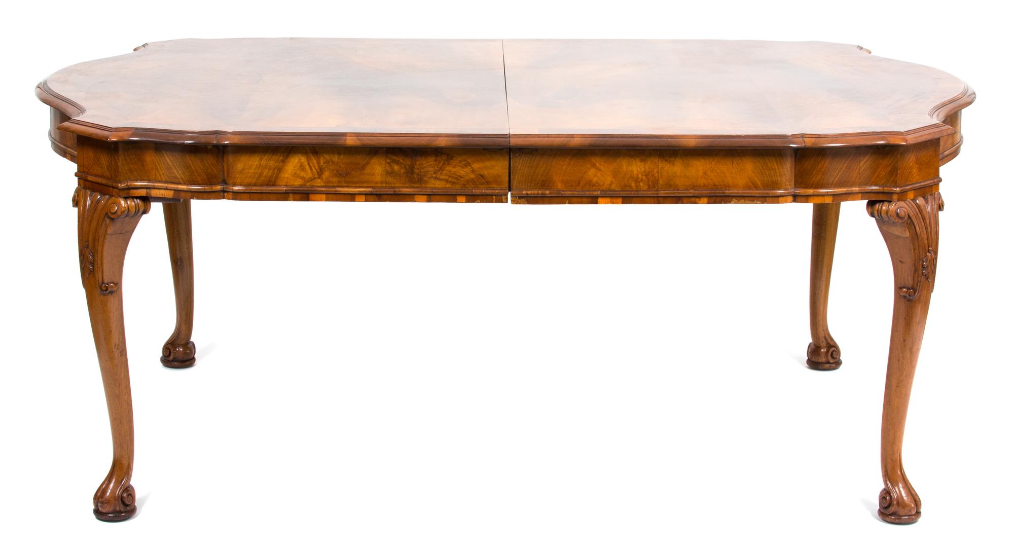 An Italian Walnut Veneered Dining Table Height 30 x width 125 1/2 x depth 47 1/2 inches. — LATE 19TH/EARLY 20TH CENTURY