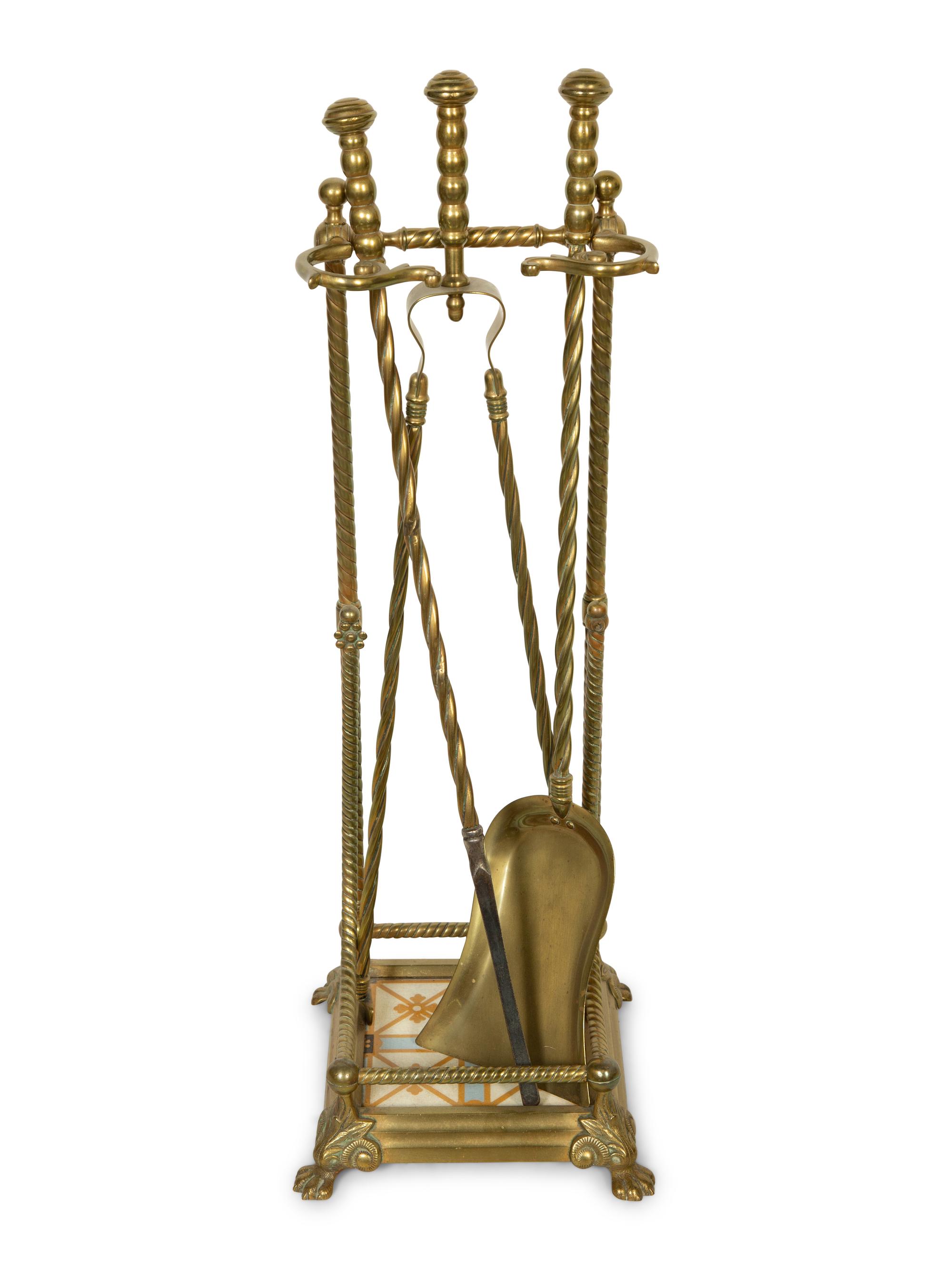 A Neoclassical Brass Fire Fender with a Set of Tools