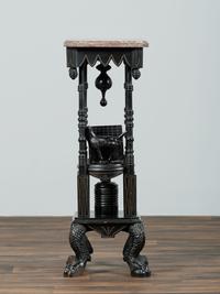 A Victorian Marble-Top Carved and Ebonized Parlor Table with Dog