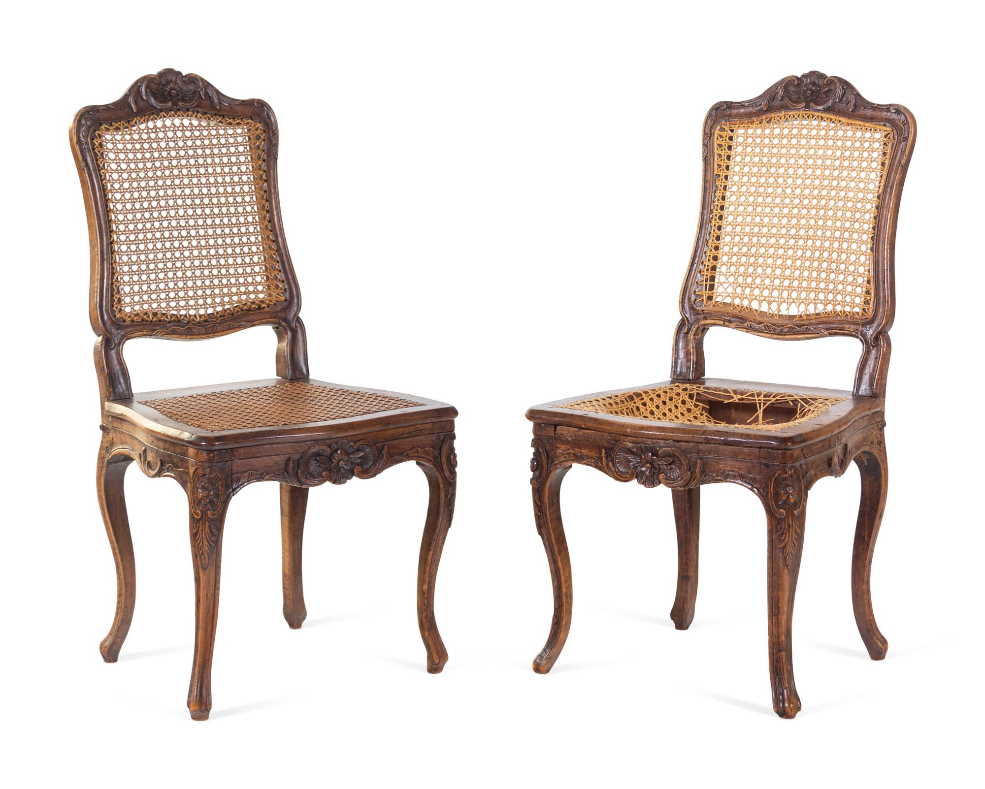 A Pair of Louis XV Carved Walnut Side Chairs