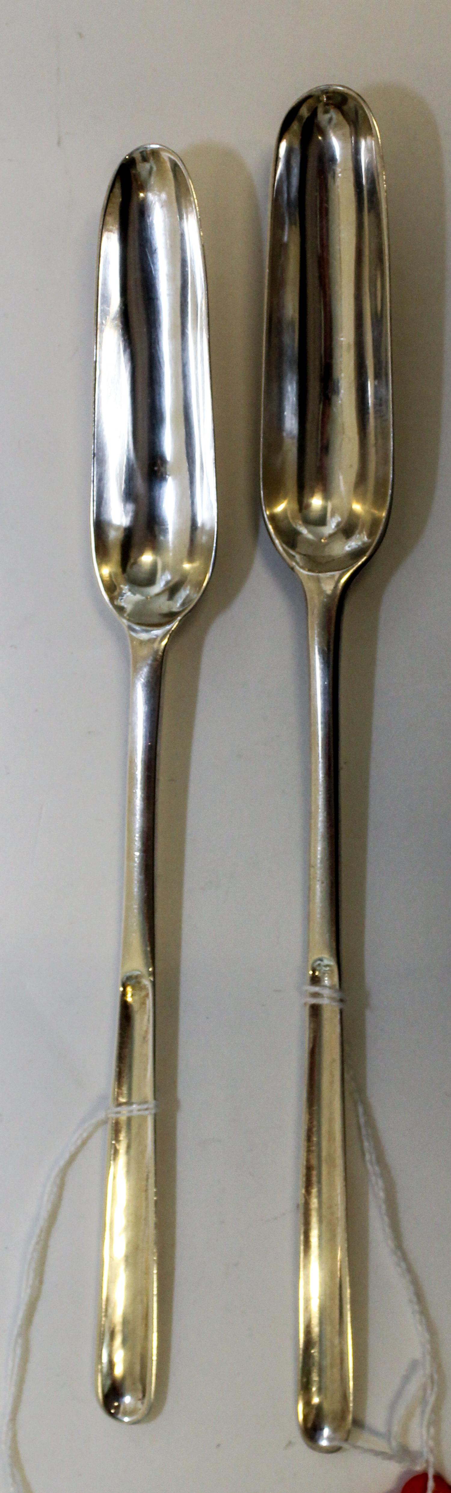 A Group of Two Georgian Silver Marrow Scoops, maker's marks obscured, of typical form.