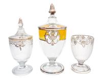 Three Silver Overlay Glass Covered Urns Height of tallest 13 inches.