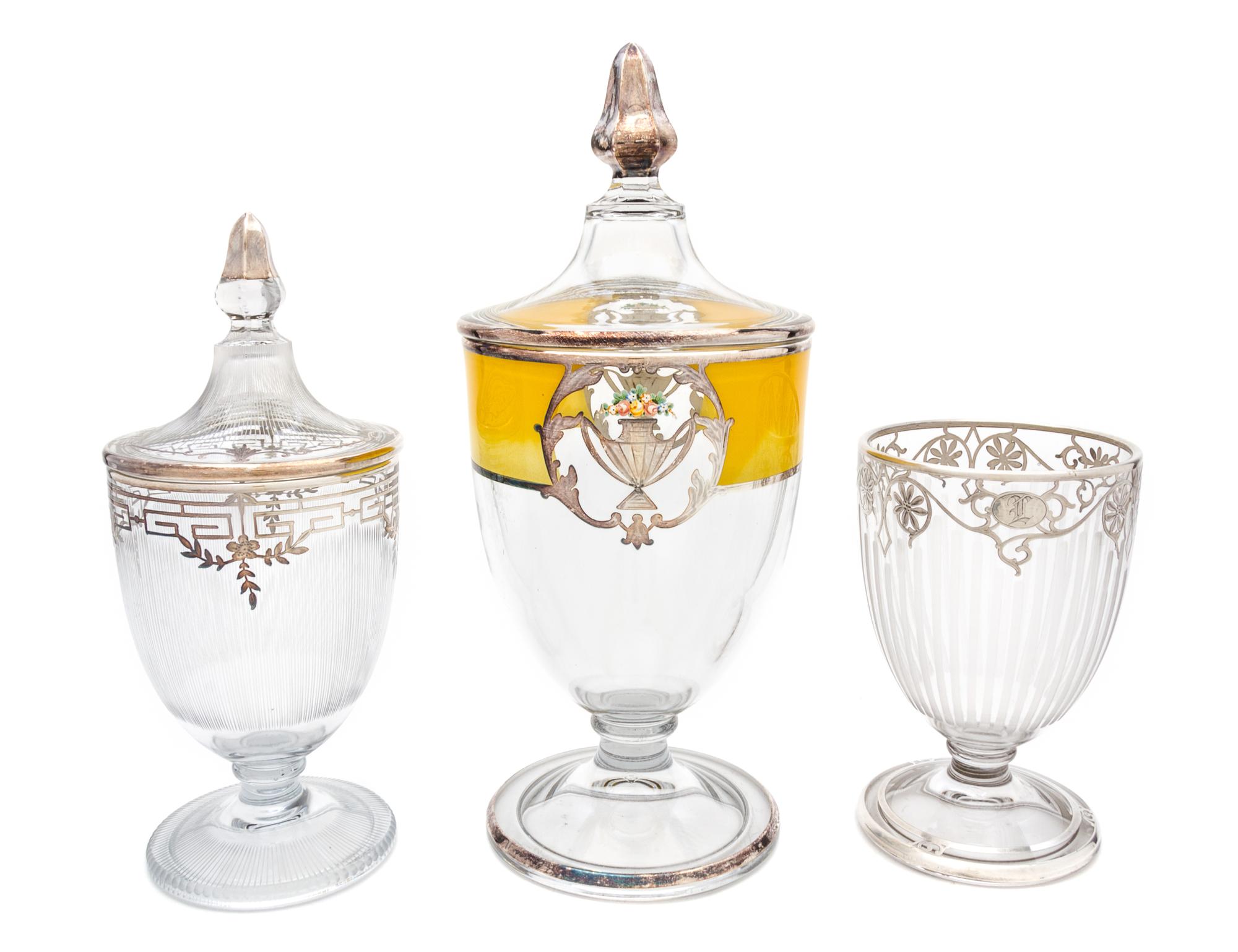 Three Silver Overlay Glass Covered Urns Height of tallest 13 inches.