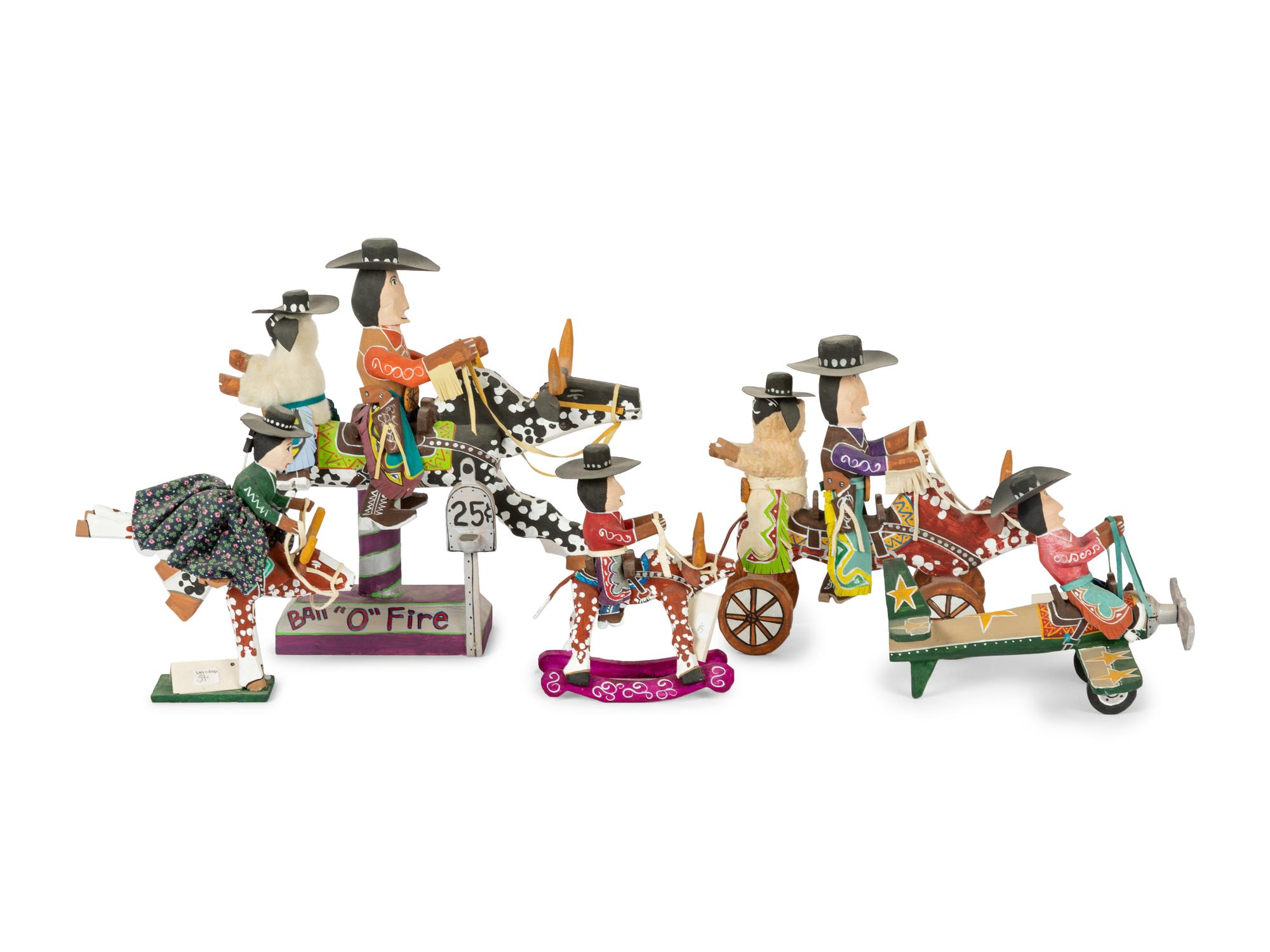 Eight Carved Wood Folk Art Sculptures