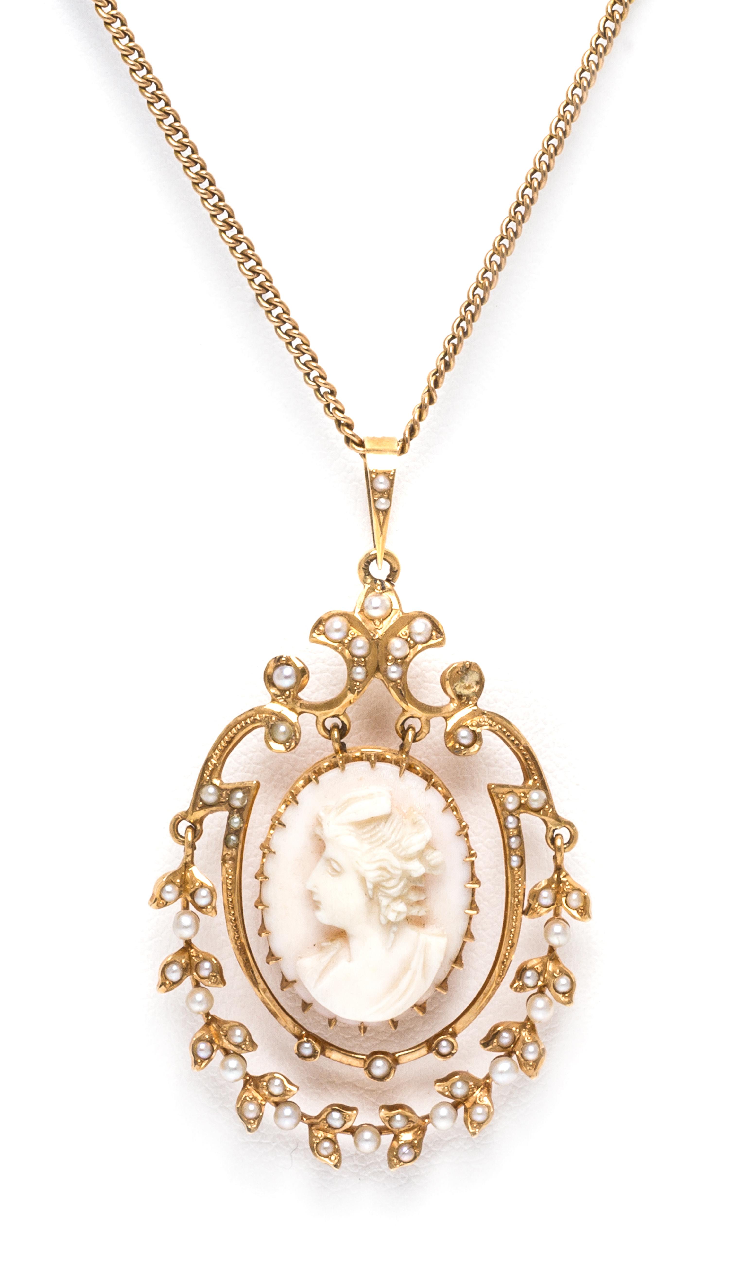 A Victorian Yellow Gold, Seed Pearl and Coral Cameo Pendant, 5.20 dwts.