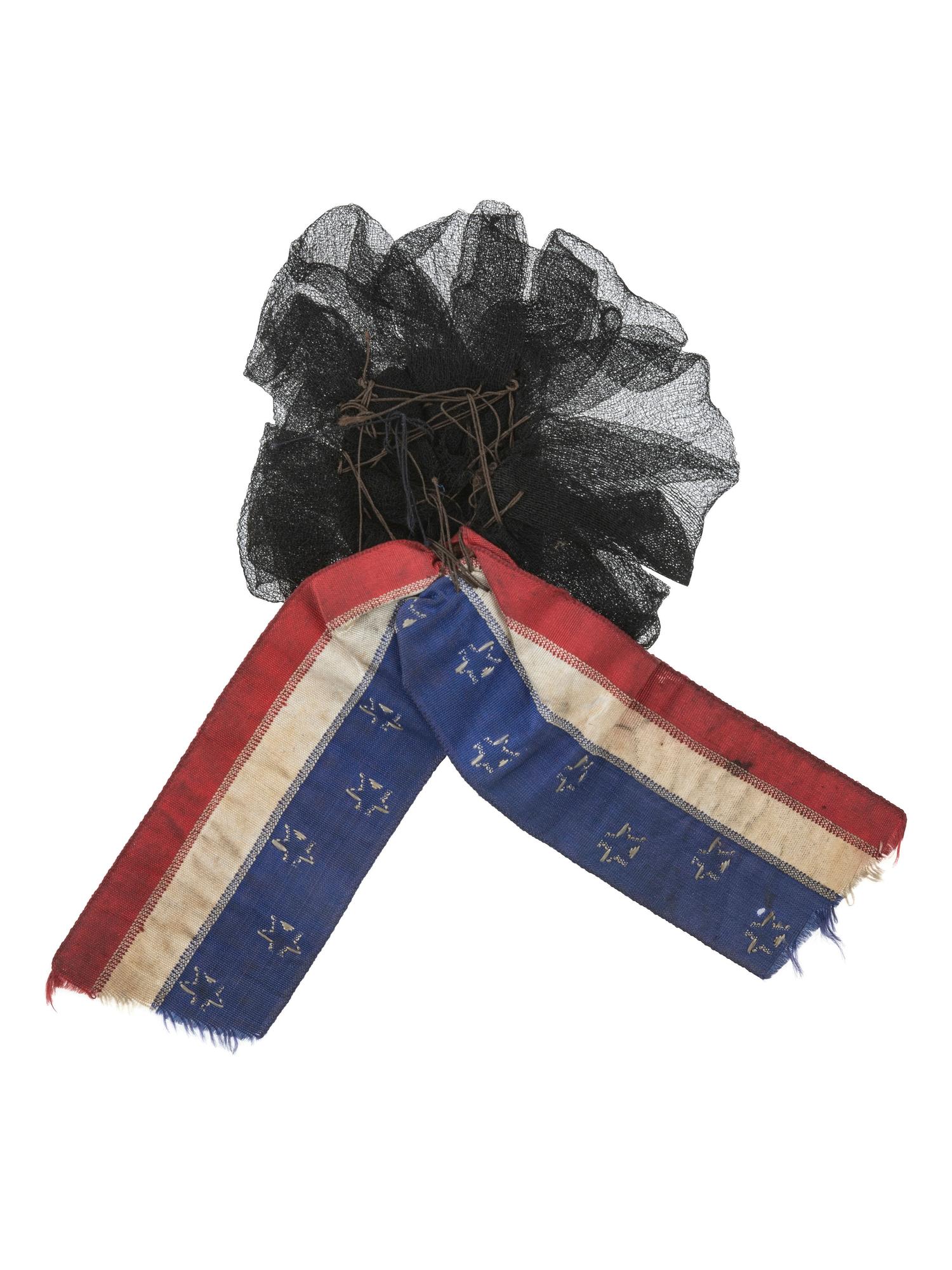 [LINCOLN, Abraham (1809-1865)]. Lincoln mourning cockade with ferrotype at center.