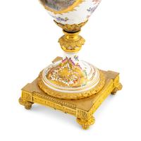 A Pair of Sèvres Style Porcelain and Gilt Bronze Mounted Urns