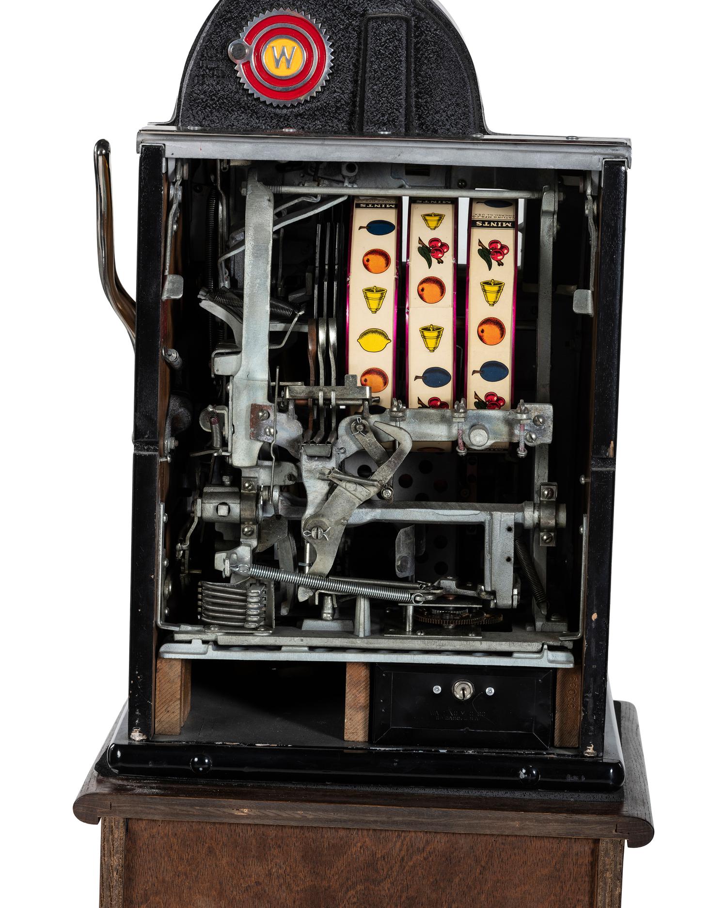 A 5 Cent Rol-A-Top Twin Jackpot Slot Machine on Reverse Printed Glass Inset Golden Nugget Stand