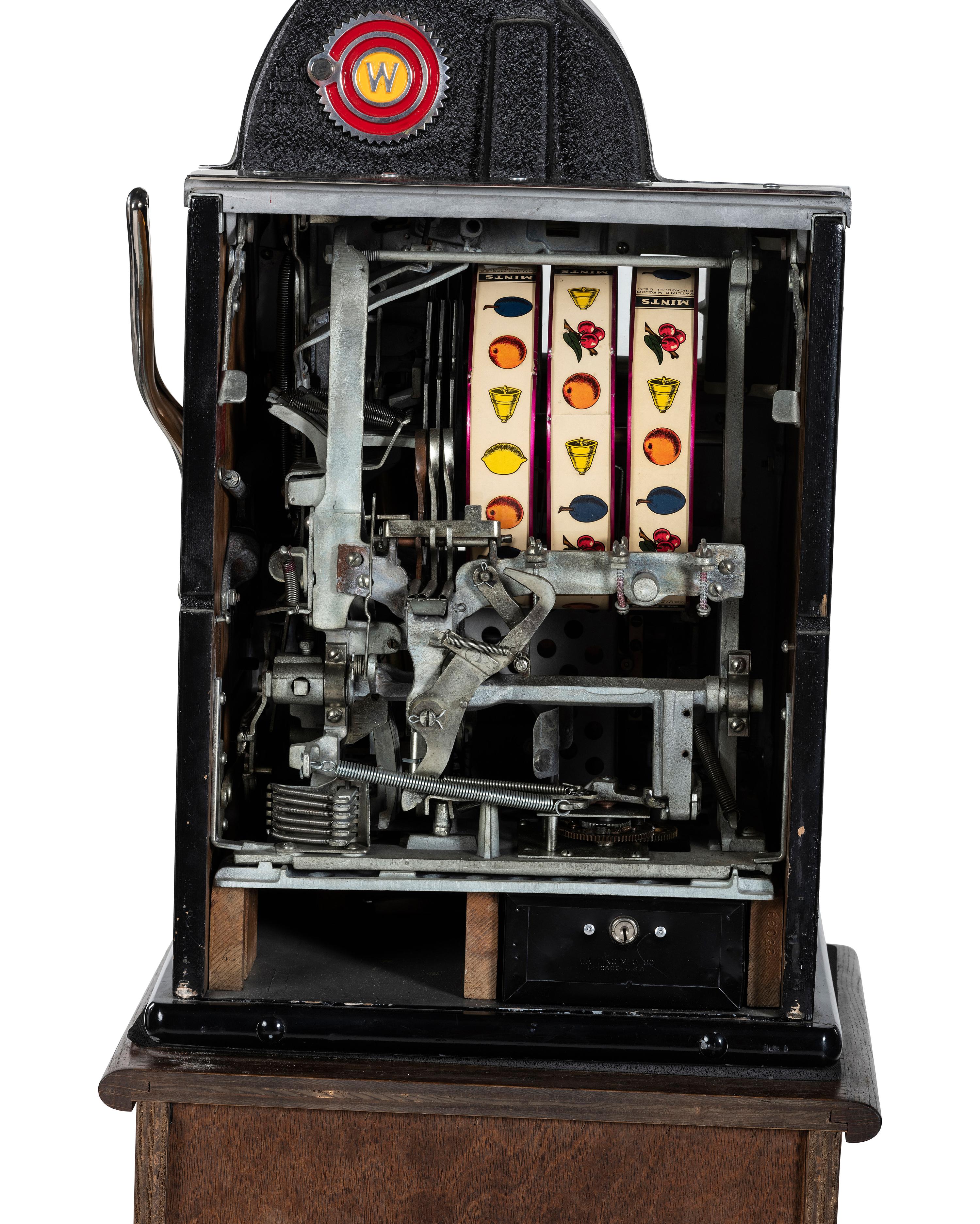 A 5 Cent Rol-A-Top Twin Jackpot Slot Machine on Reverse Printed Glass Inset Golden Nugget Stand
