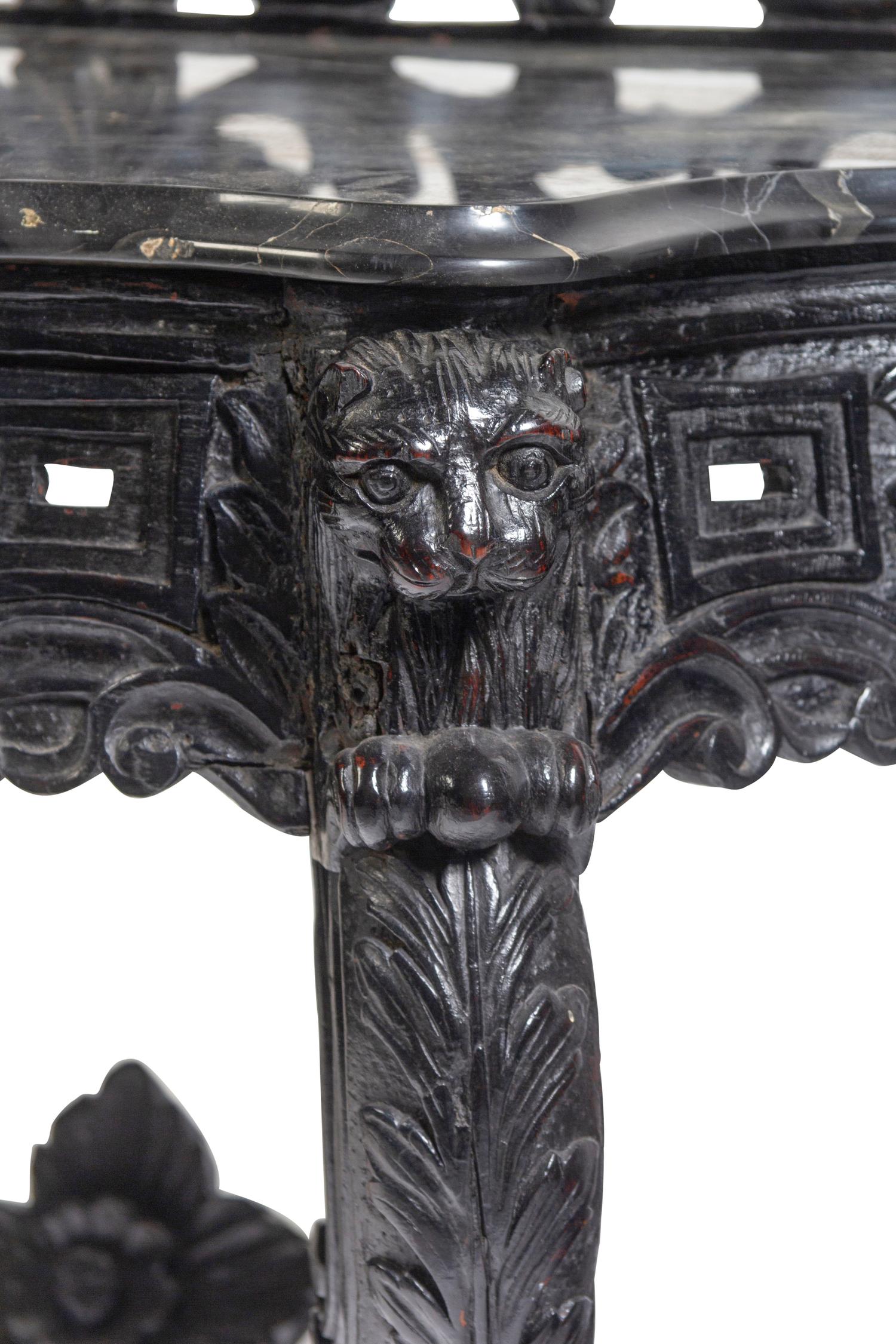 An Anglo-Indian Carved and Ebonized Console Table