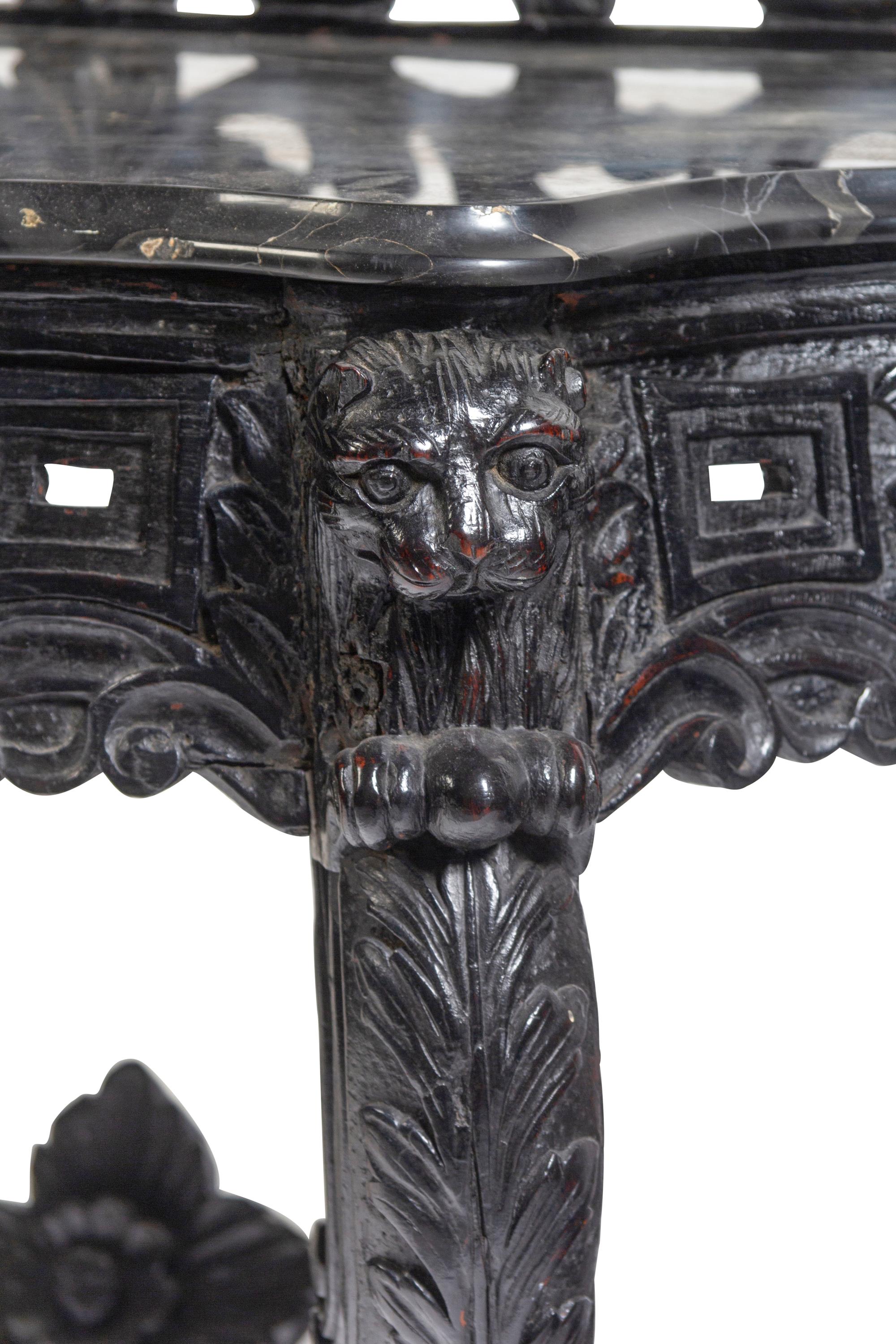 An Anglo-Indian Carved and Ebonized Console Table