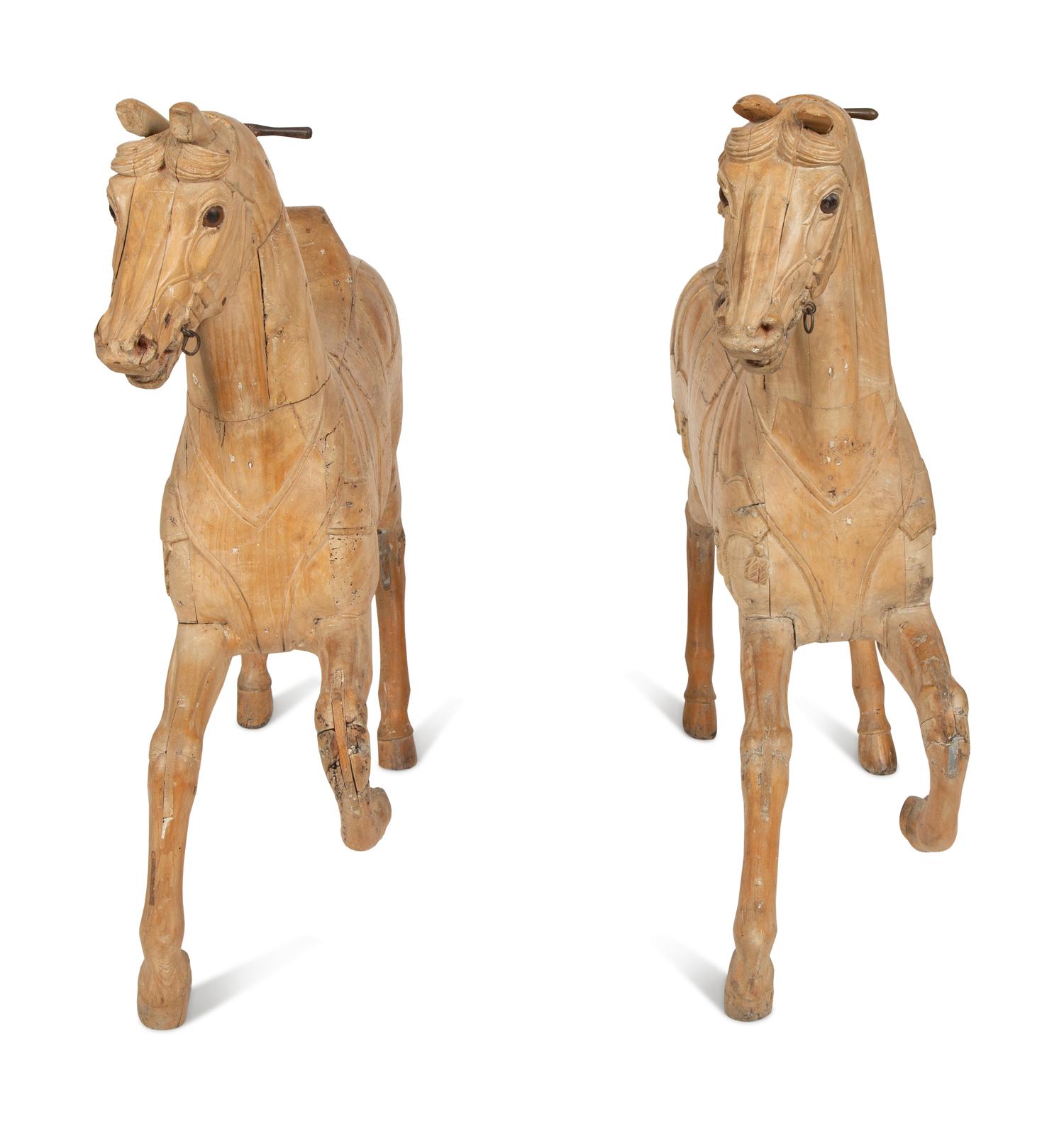 A Pair of Italian Carved Wood Carousel Horses in the Manner of Gustav Dentzel