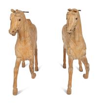 A Pair of Italian Carved Wood Carousel Horses in the Manner of Gustav Dentzel