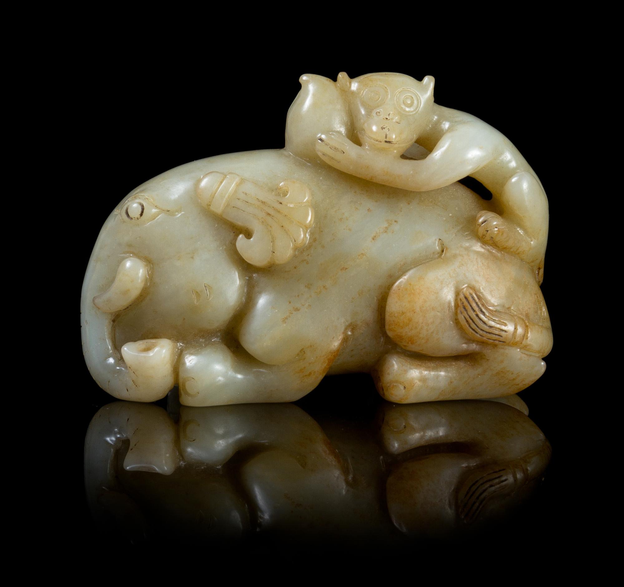 A Carved Jade Toggle Length 2 3/4 inches.