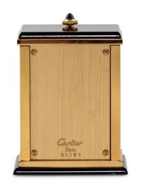 A Cartier Engraved Brass and Onyx Travel Clock