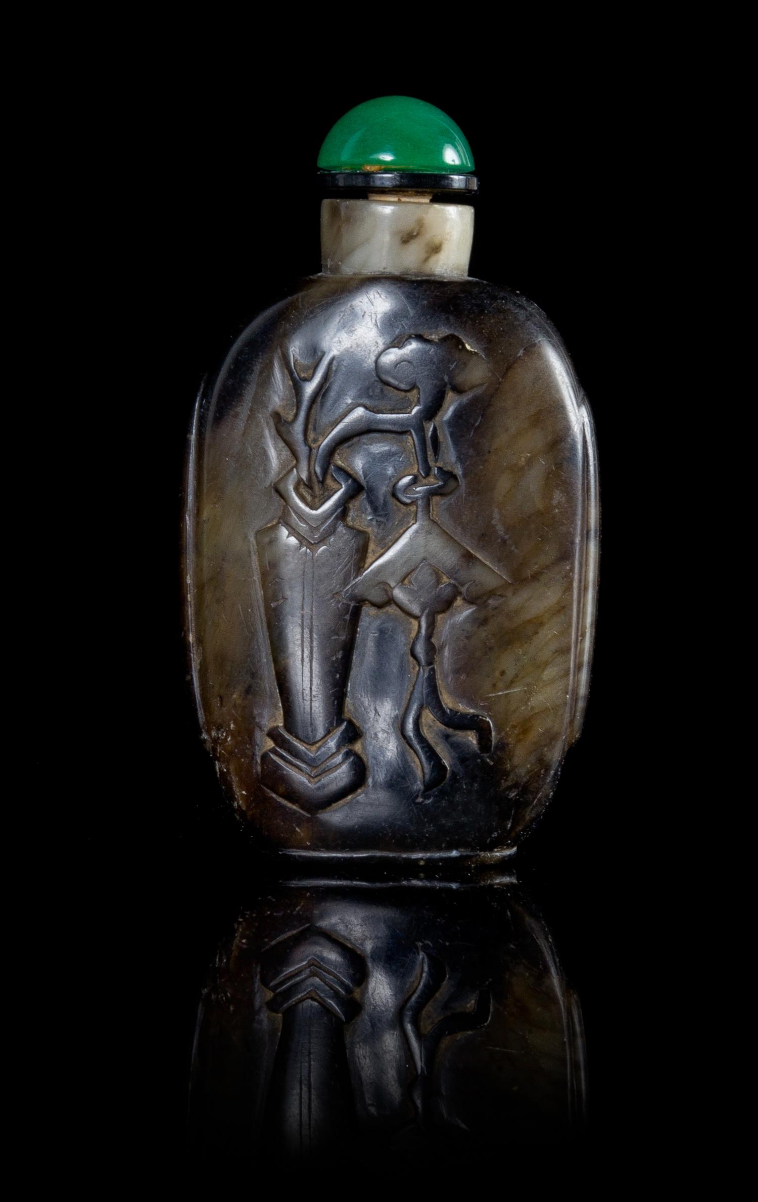A Black and White Jade Snuff Bottle Height 3 inches. — 19TH CENTURY