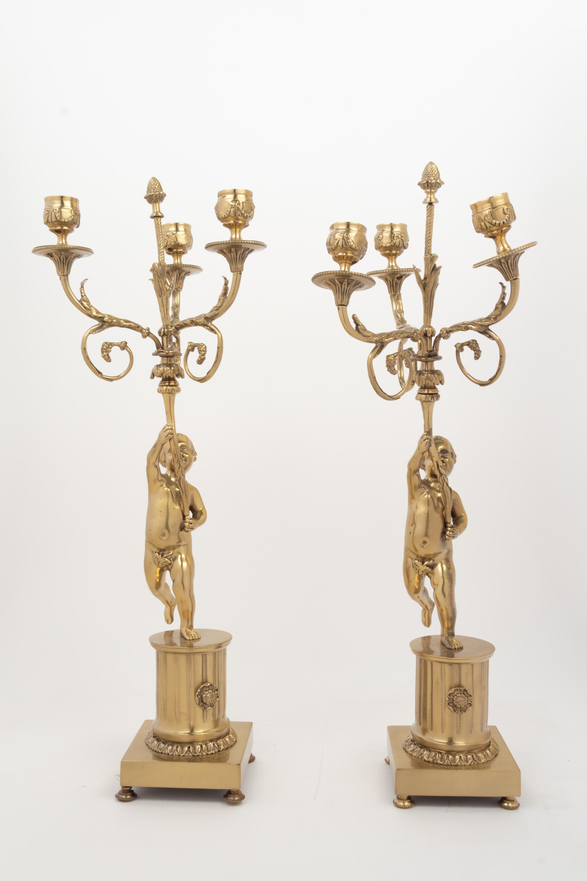 A Pair of Louis XV Style Gilt Metal Three-Light Candelabra