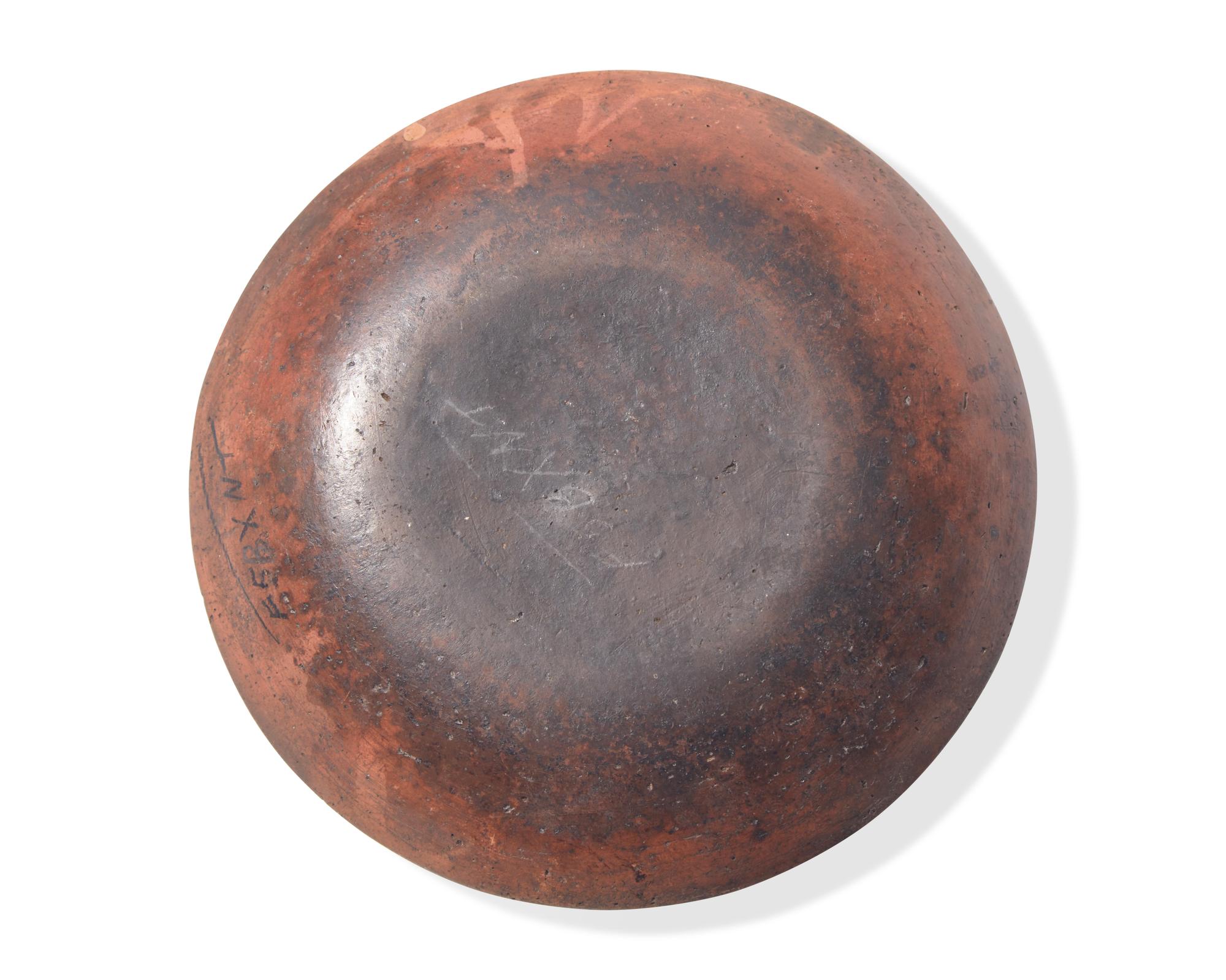 A Green and Brown Slip-Decorated Redware Pie Plate, Dryville, Pennsylvania, 19th Century