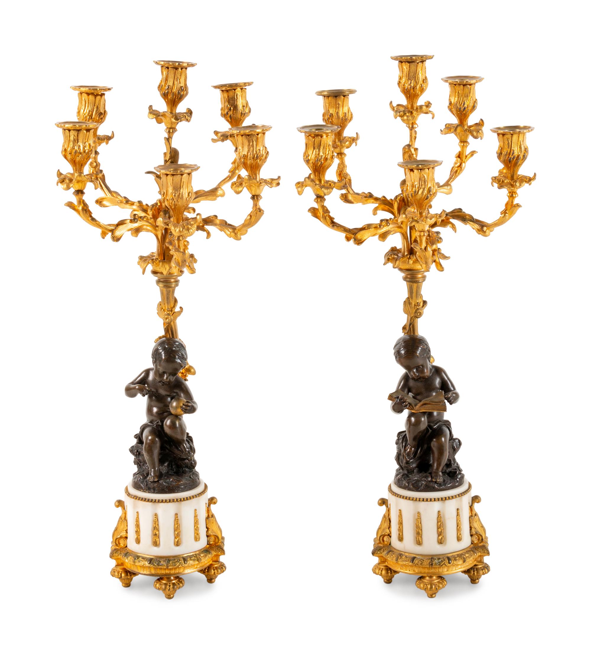A Pair of Louis XVI Style Gilt and Patinated Bronze Six-Light Figural Candelabra