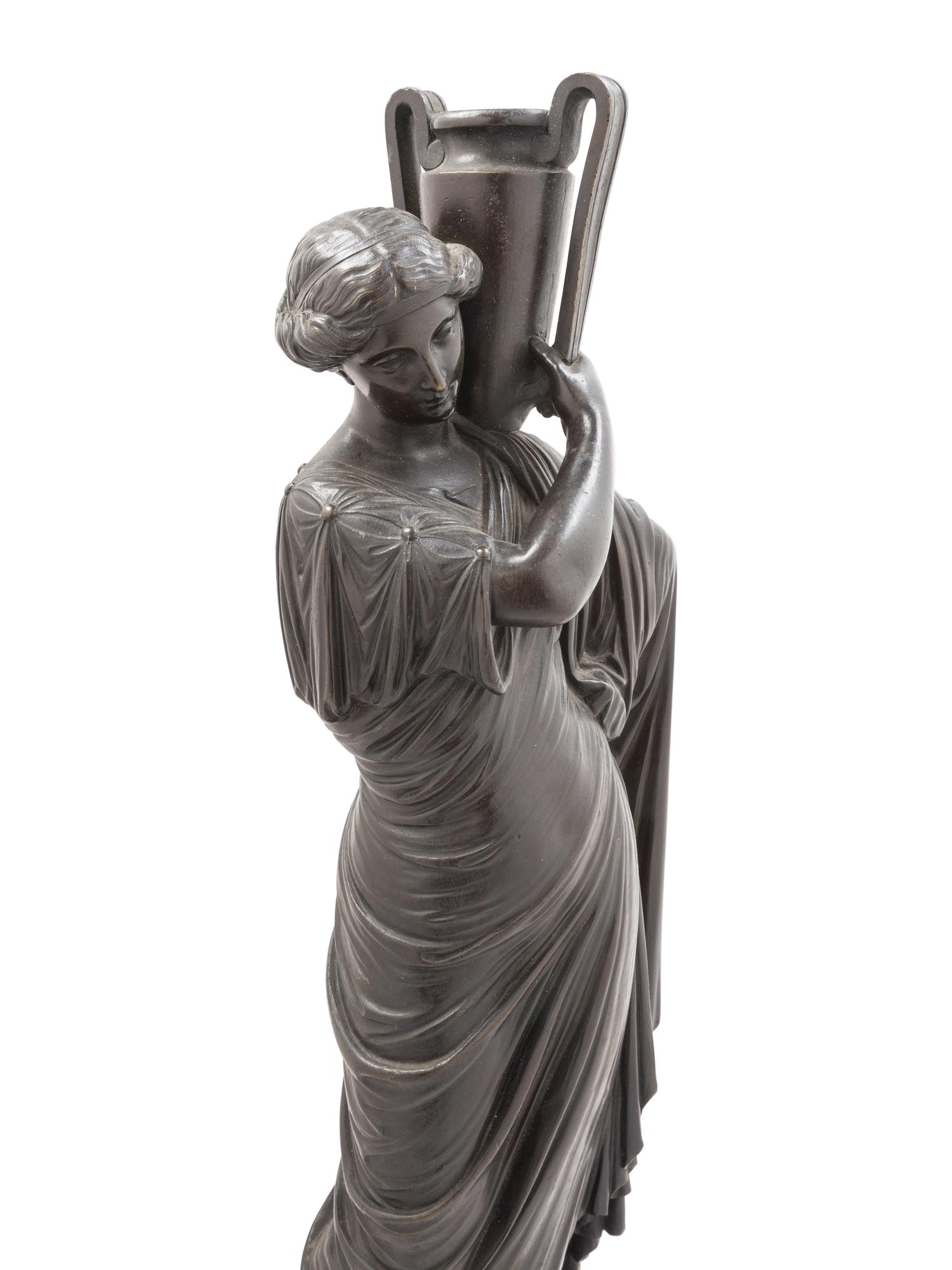 A Continental Bronze Figure of a Classical Maiden with an Ewer