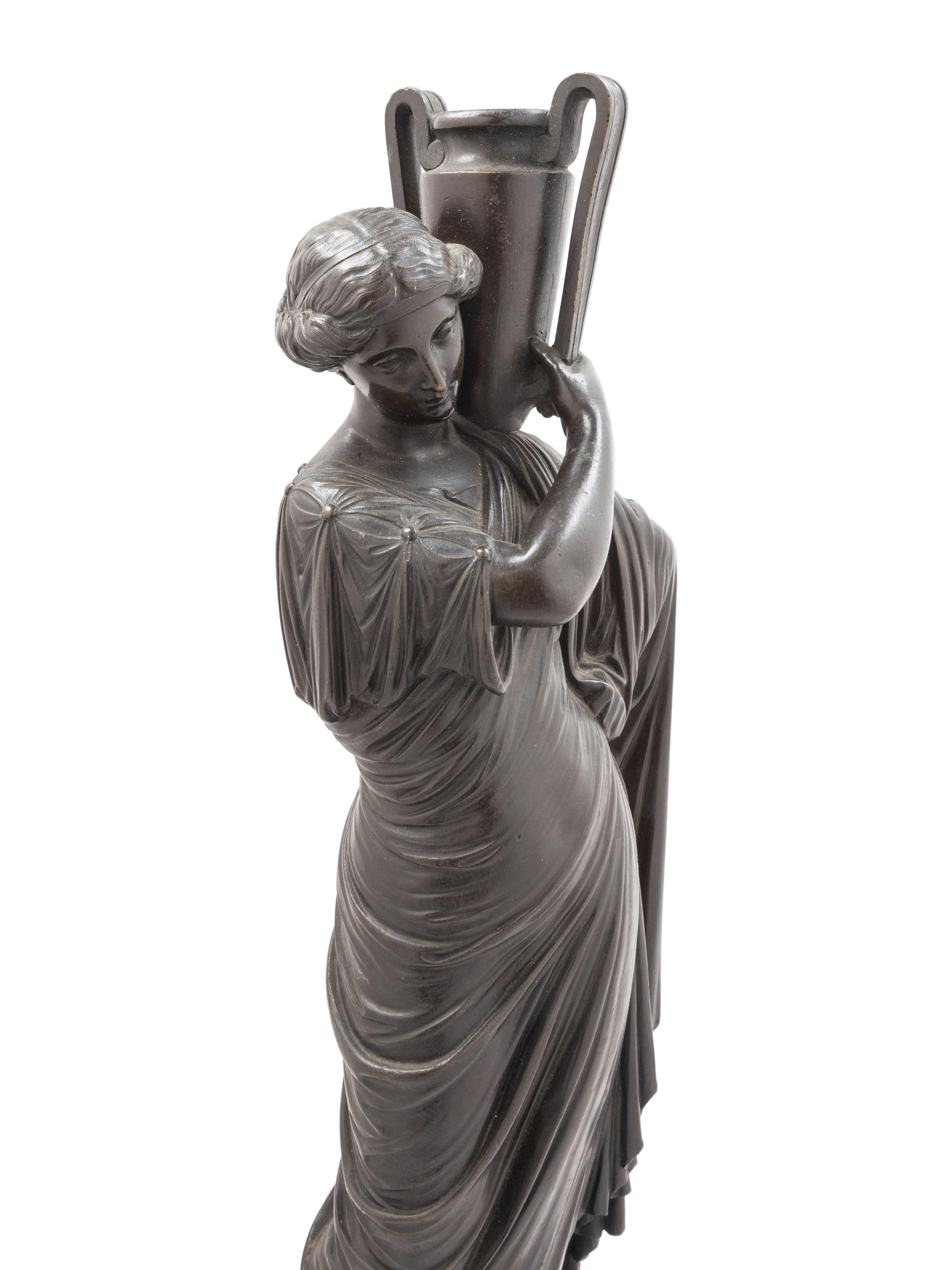 A Continental Bronze Figure of a Classical Maiden with an Ewer