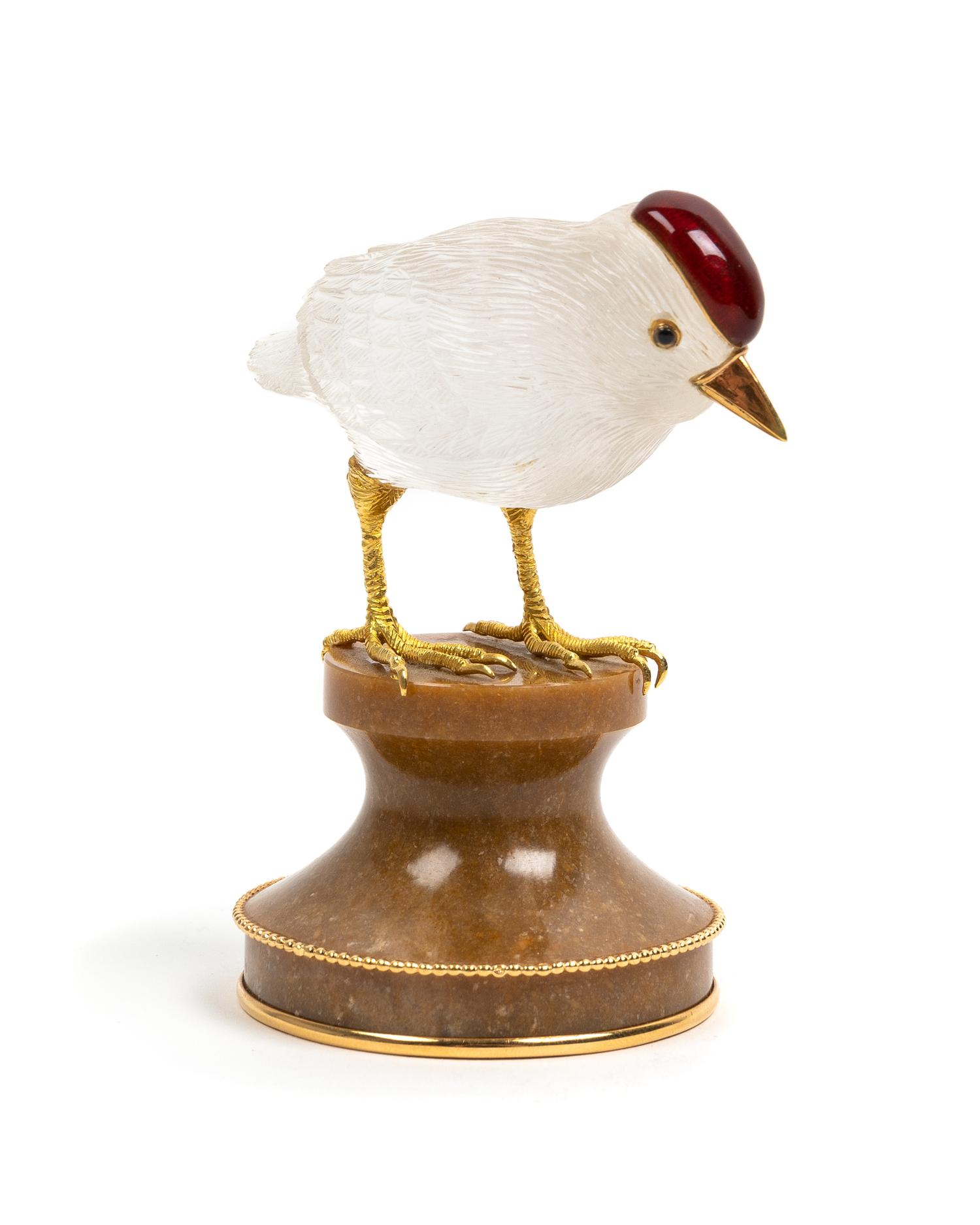 A French 18 Karat Gold Mounted, Enamel and Carved Quartz Zoomorphic Figure, Boucheron, Paris, 20th Century, of a bird on a carved hards