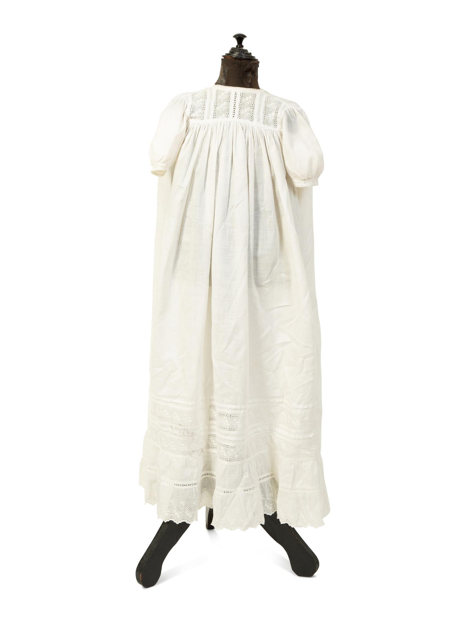 A Victorian Child's Mannequin Dressed in a White Christening Dress — 19TH CENTURY