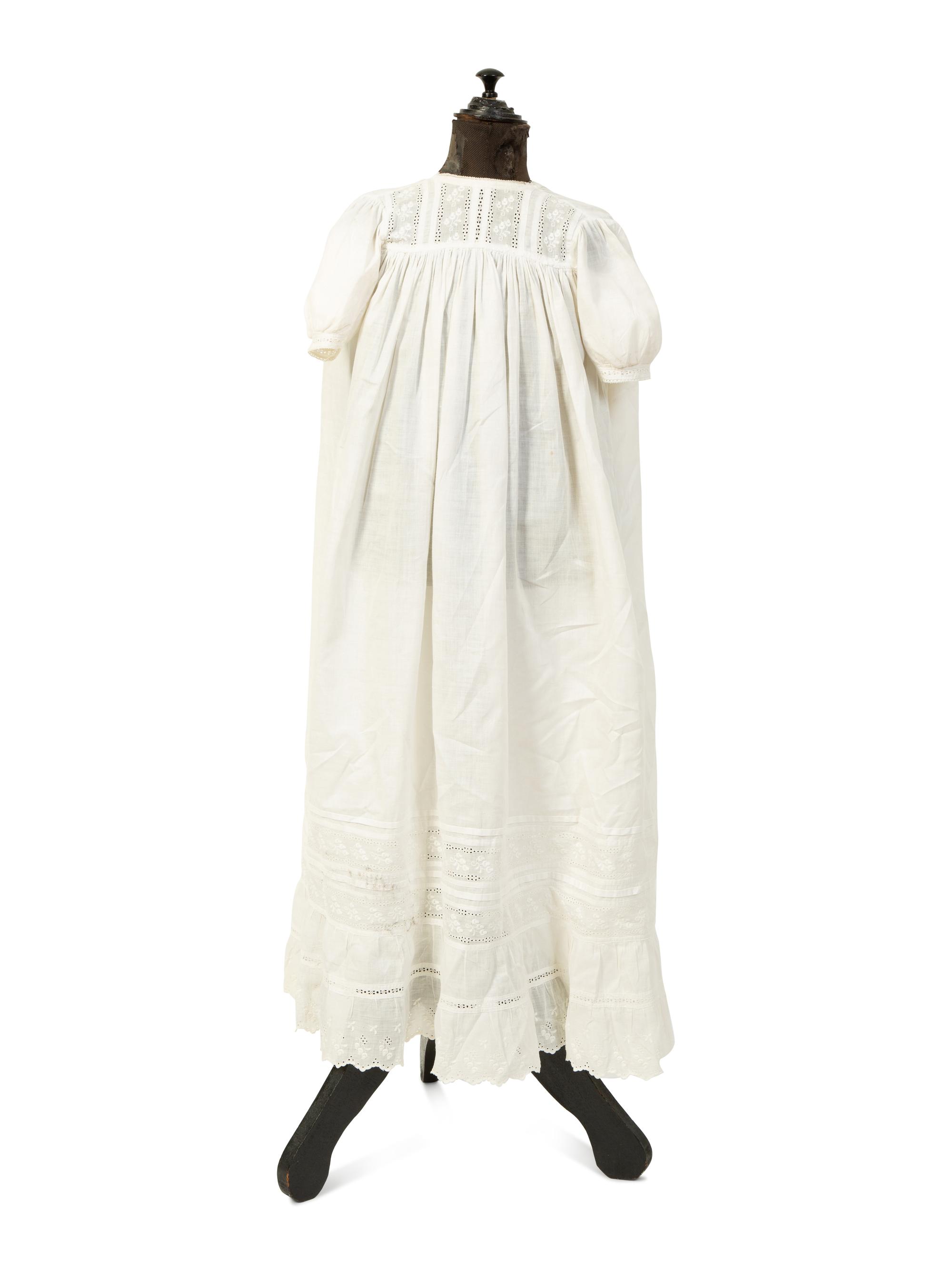 A Victorian Child's Mannequin Dressed in a White Christening Dress — 19TH CENTURY