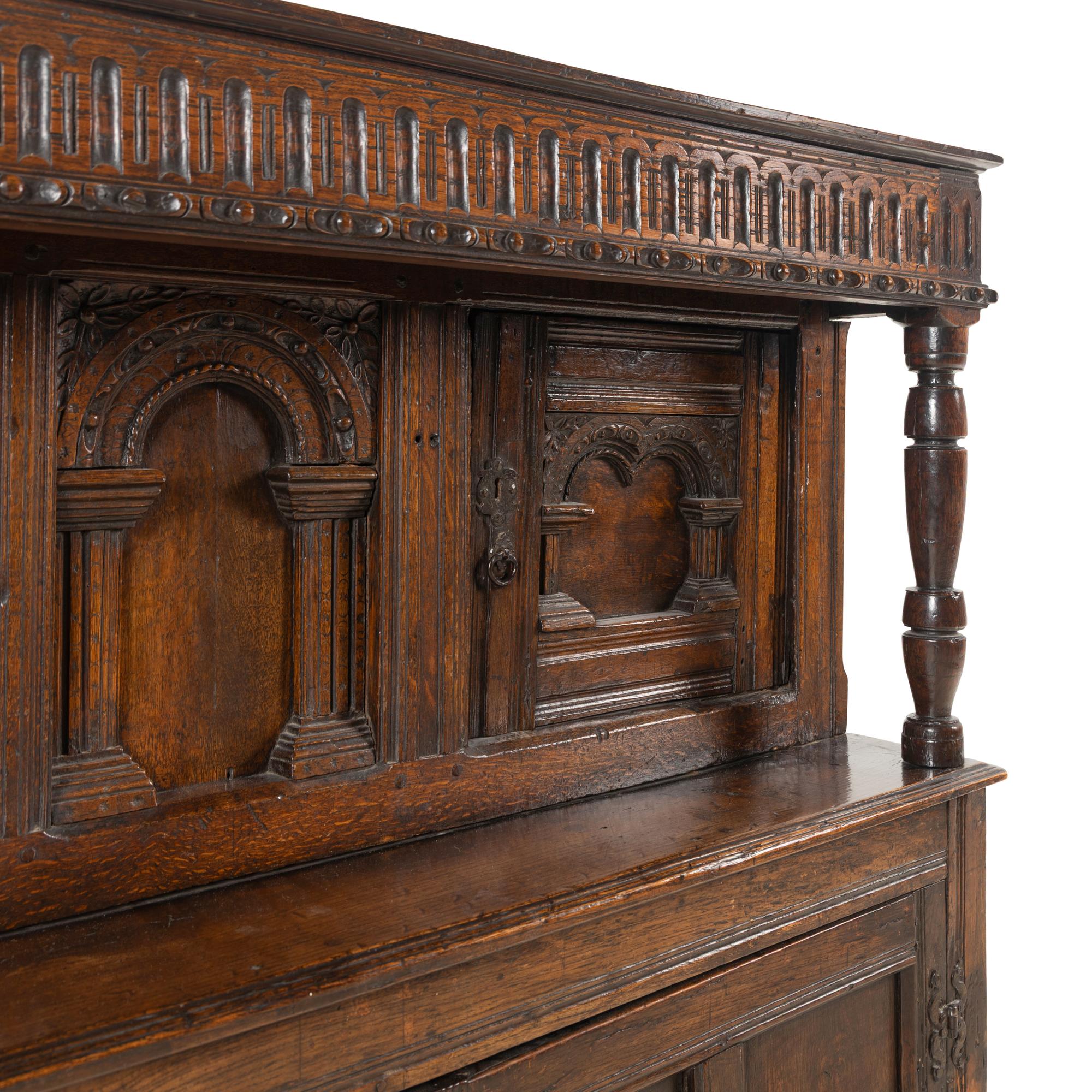 A Jacobean Carved Oak Court Cupboard