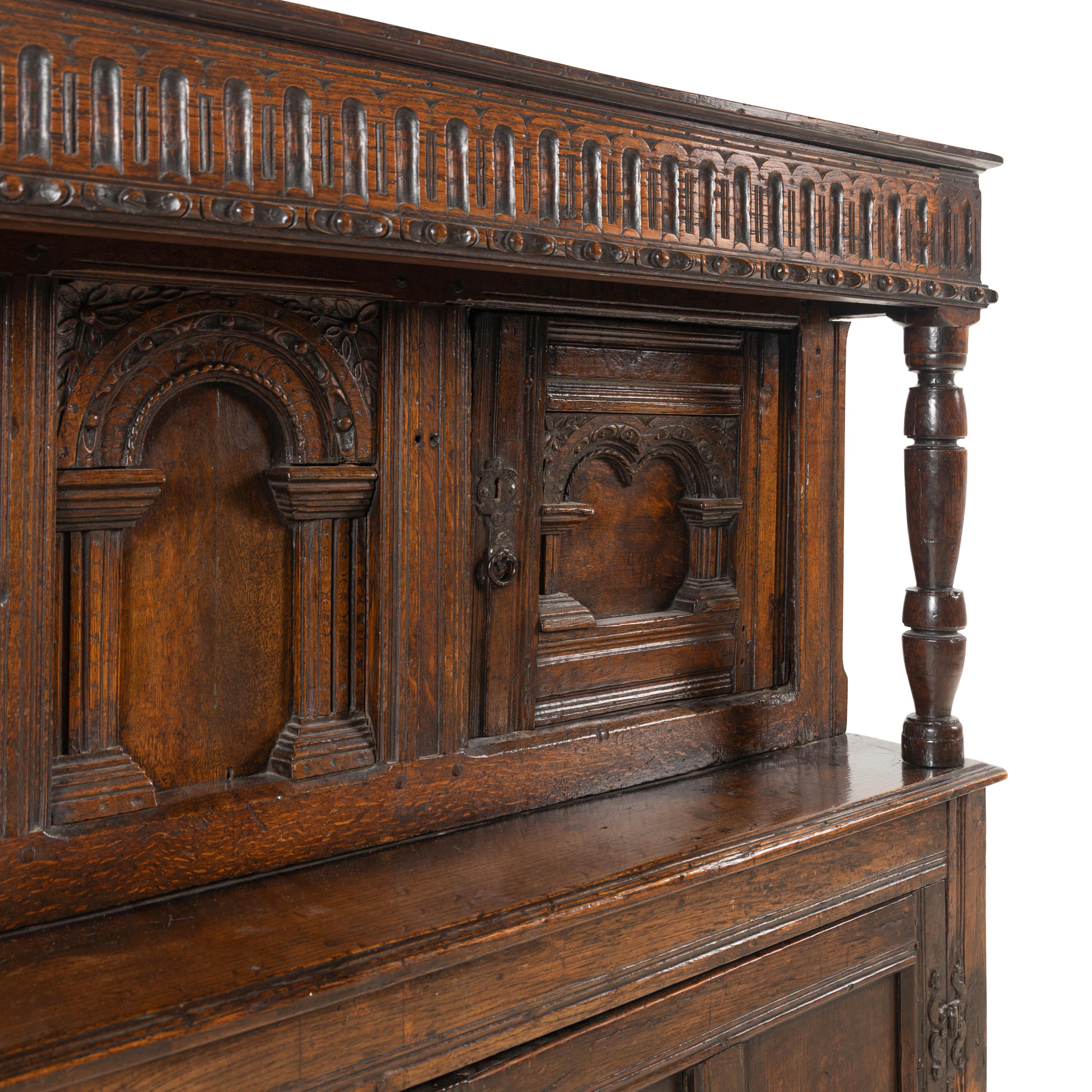 A Jacobean Carved Oak Court Cupboard