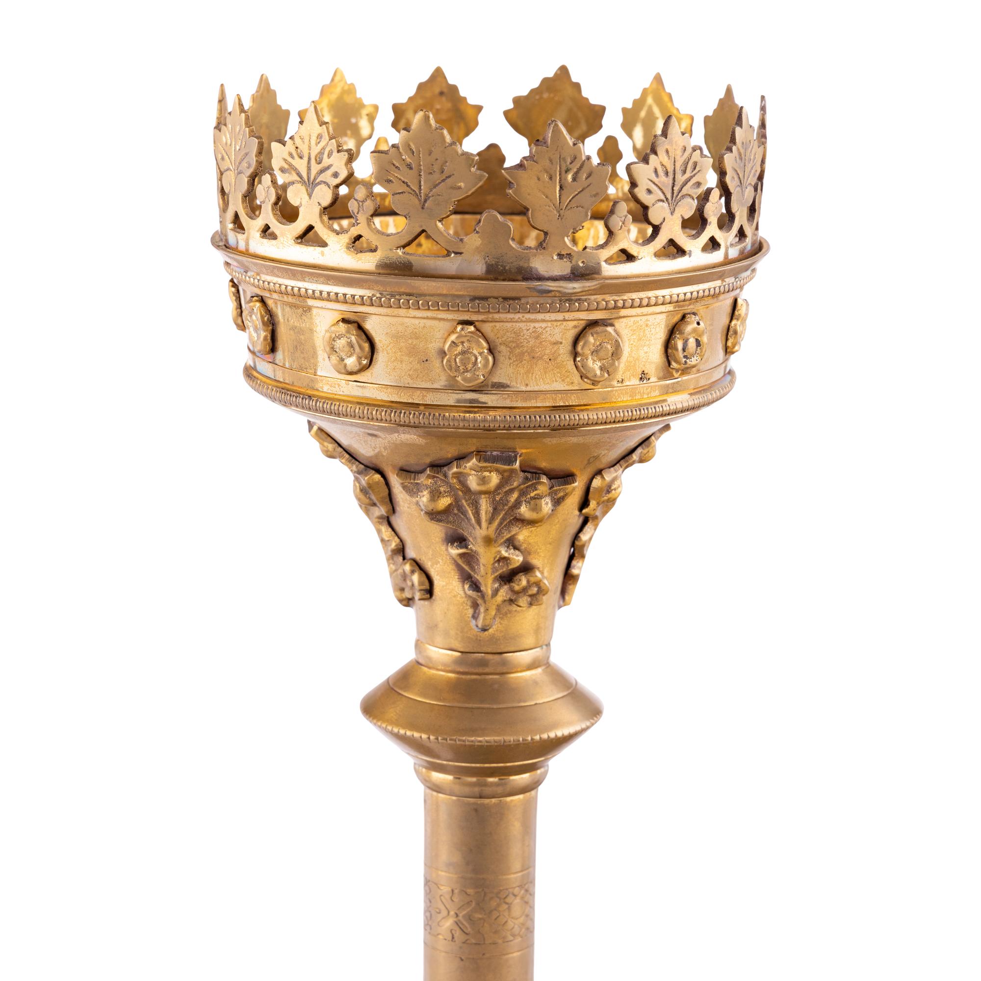 A Collection of Seven Brass Altar Candlesticks