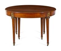 A Louis XVI Style Gilt Metal Mounted Walnut and Marquetry Extension Dining Table