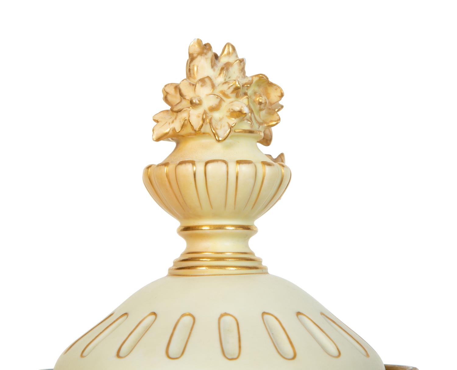 A Rudolstadt Painted and Parcel Gilt Porcelain Lidded Urn