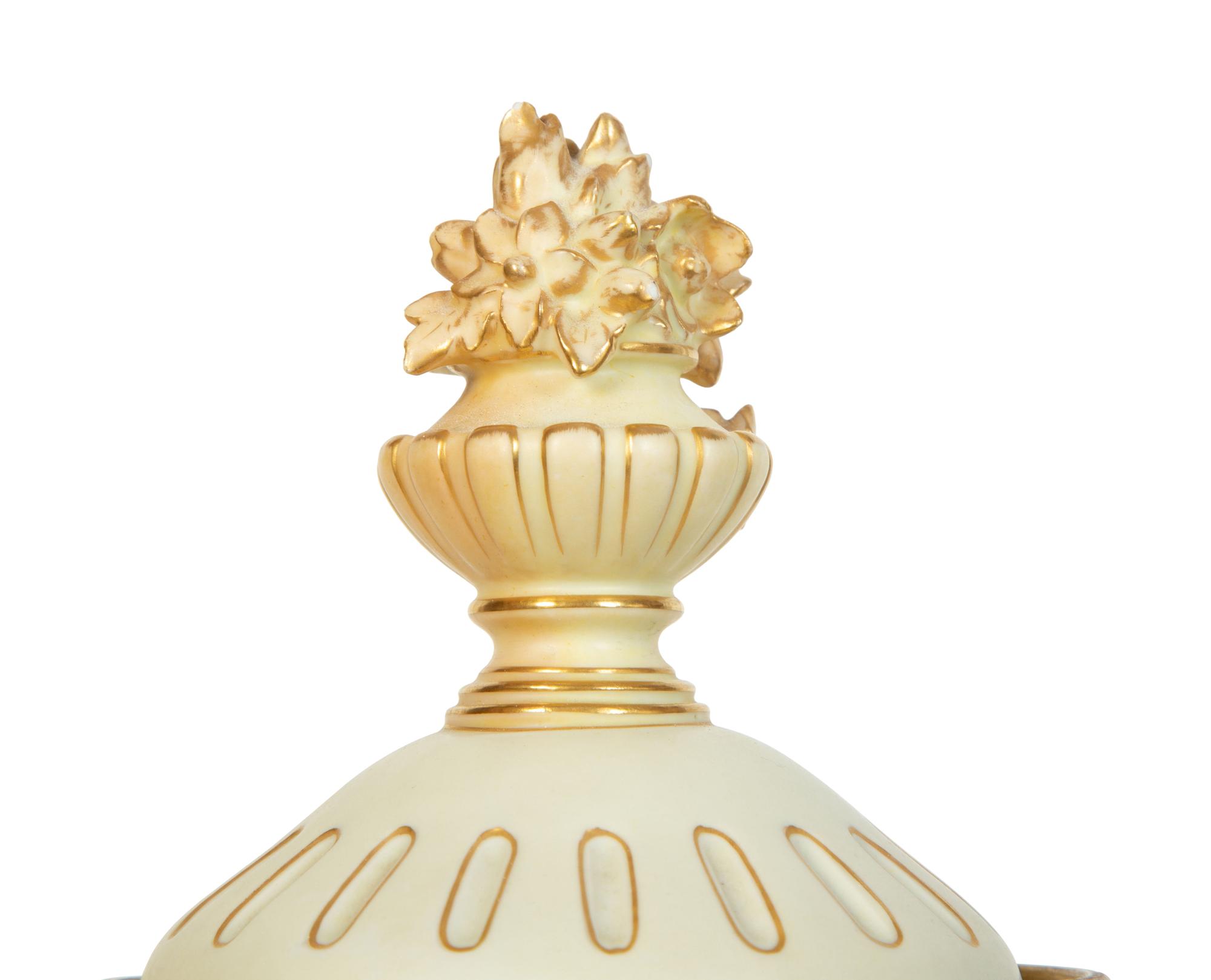 A Rudolstadt Painted and Parcel Gilt Porcelain Lidded Urn