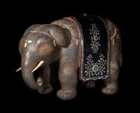 A Japanese Mother-of-Pearl Inlaid Lacquered Wood Okimono of an Elephant