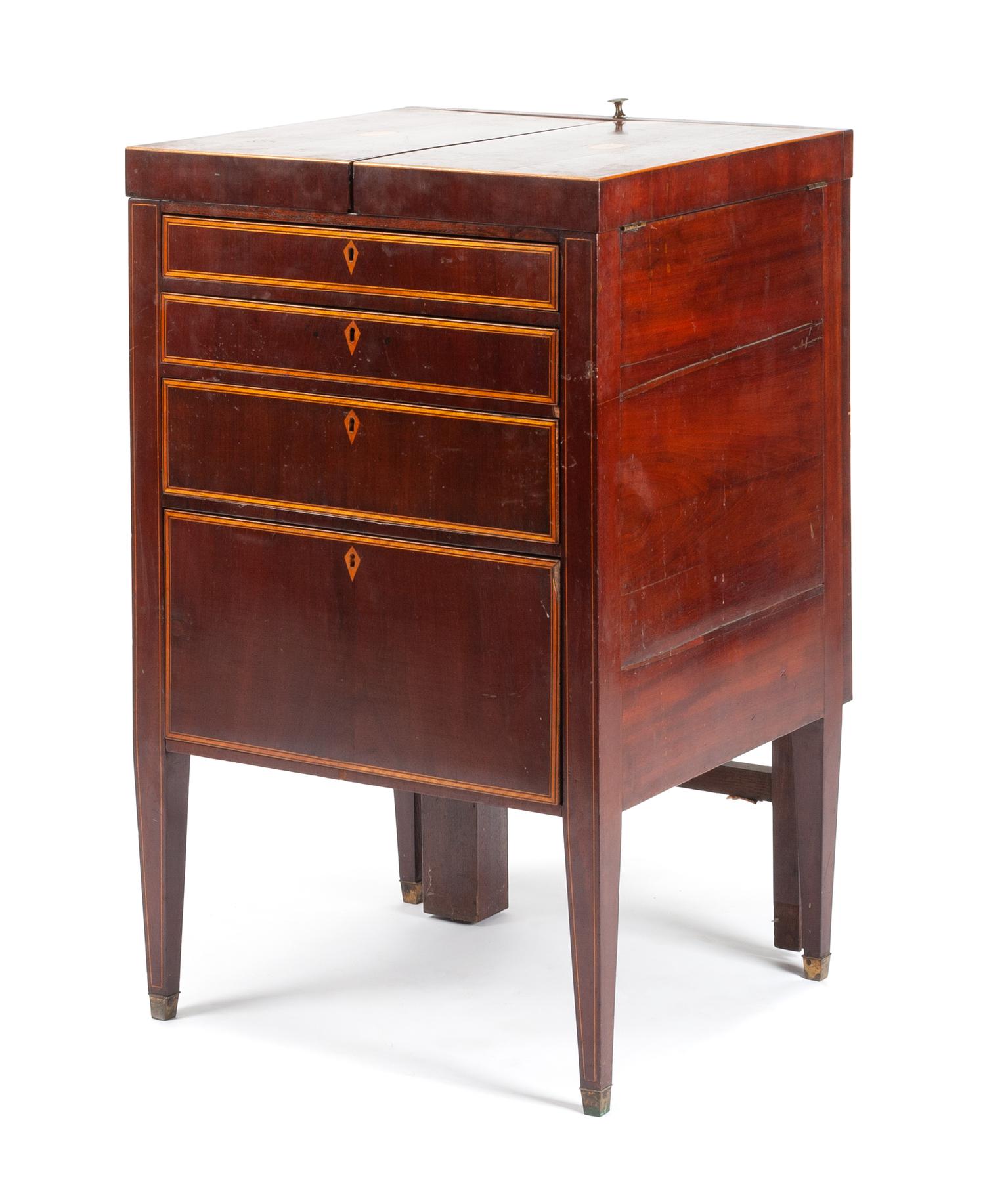 A George III Mahogany Lift-Top Dressing Table Height 35 x width 22 x depth 20 1/2 inches. — EARLY 19TH CENTURY