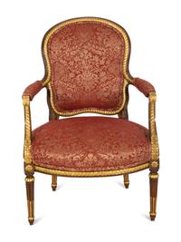 A Louis XVI Style Stained and Gilt Mahogany Fauteuil