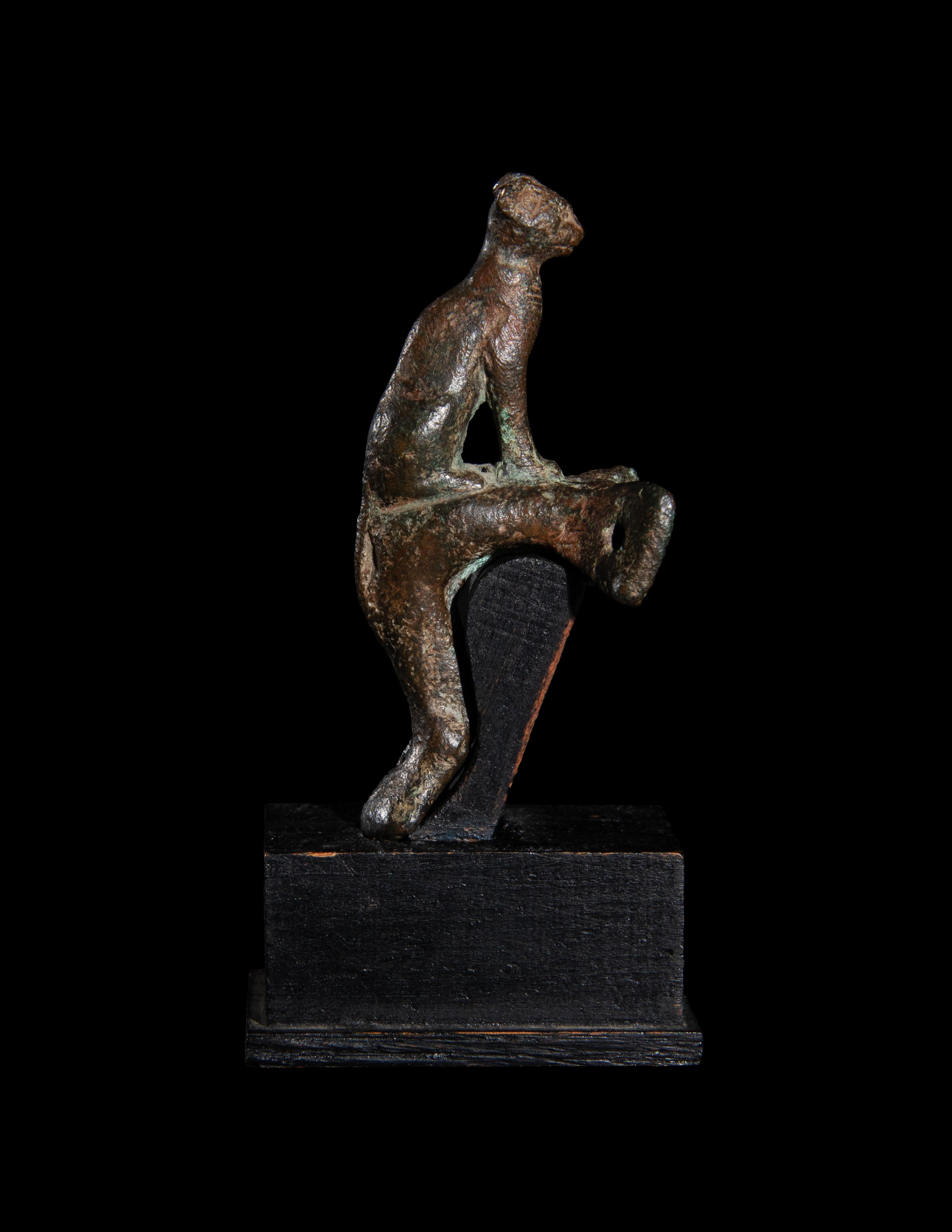 An Egyptian Bronze Handle with a Cat