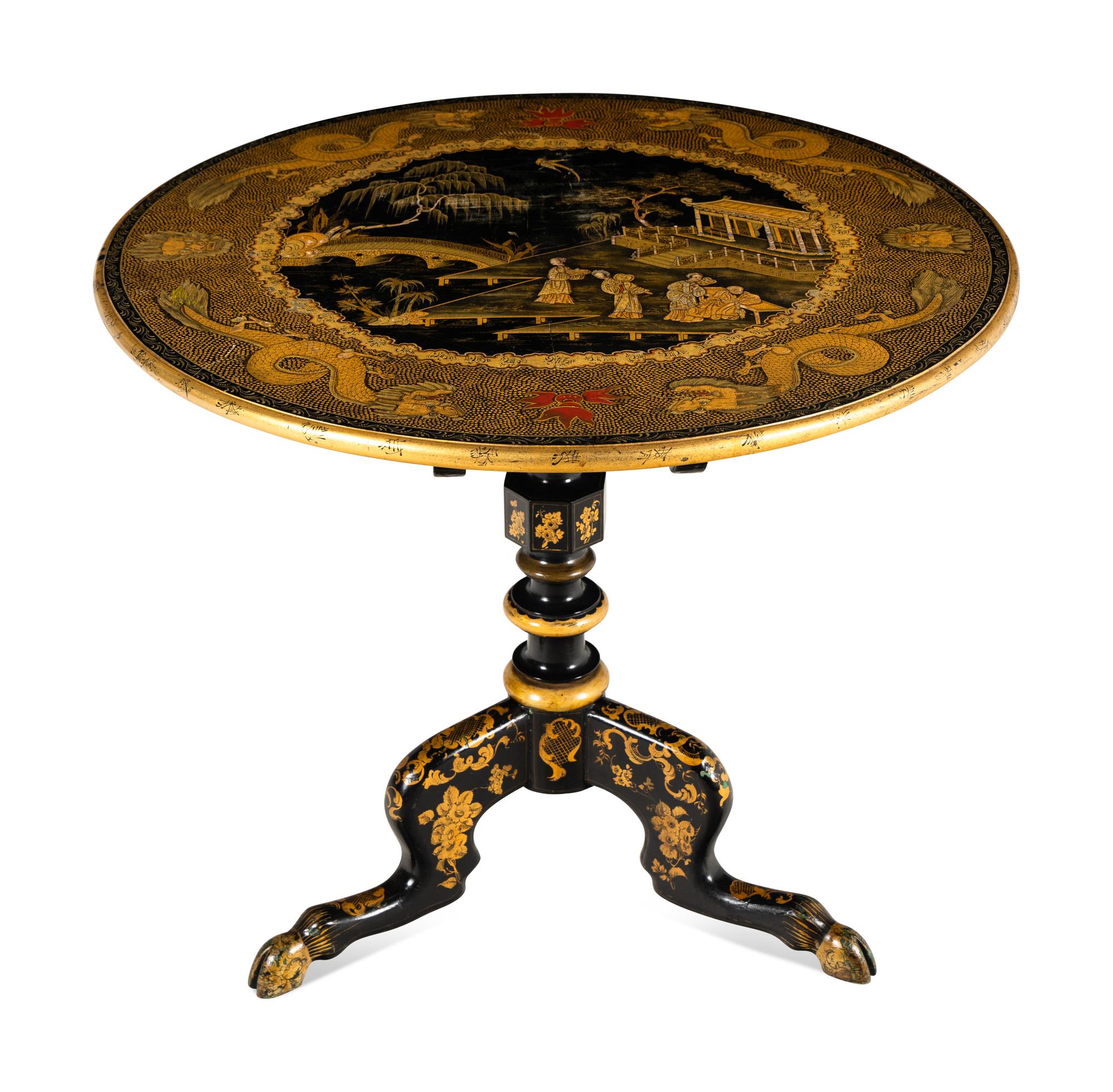 A Regency Style Lacquered and Gilt Decorated Tilt Top Tea Table