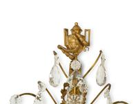 A Pair of Louis XVI Style Gilt Bronze and Cut Glass Three-Light Sconces